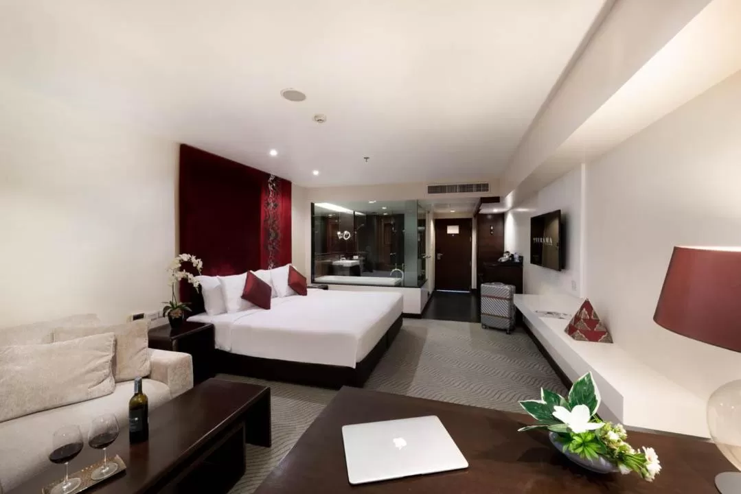 Living room, Bed in Furama Silom Hotel