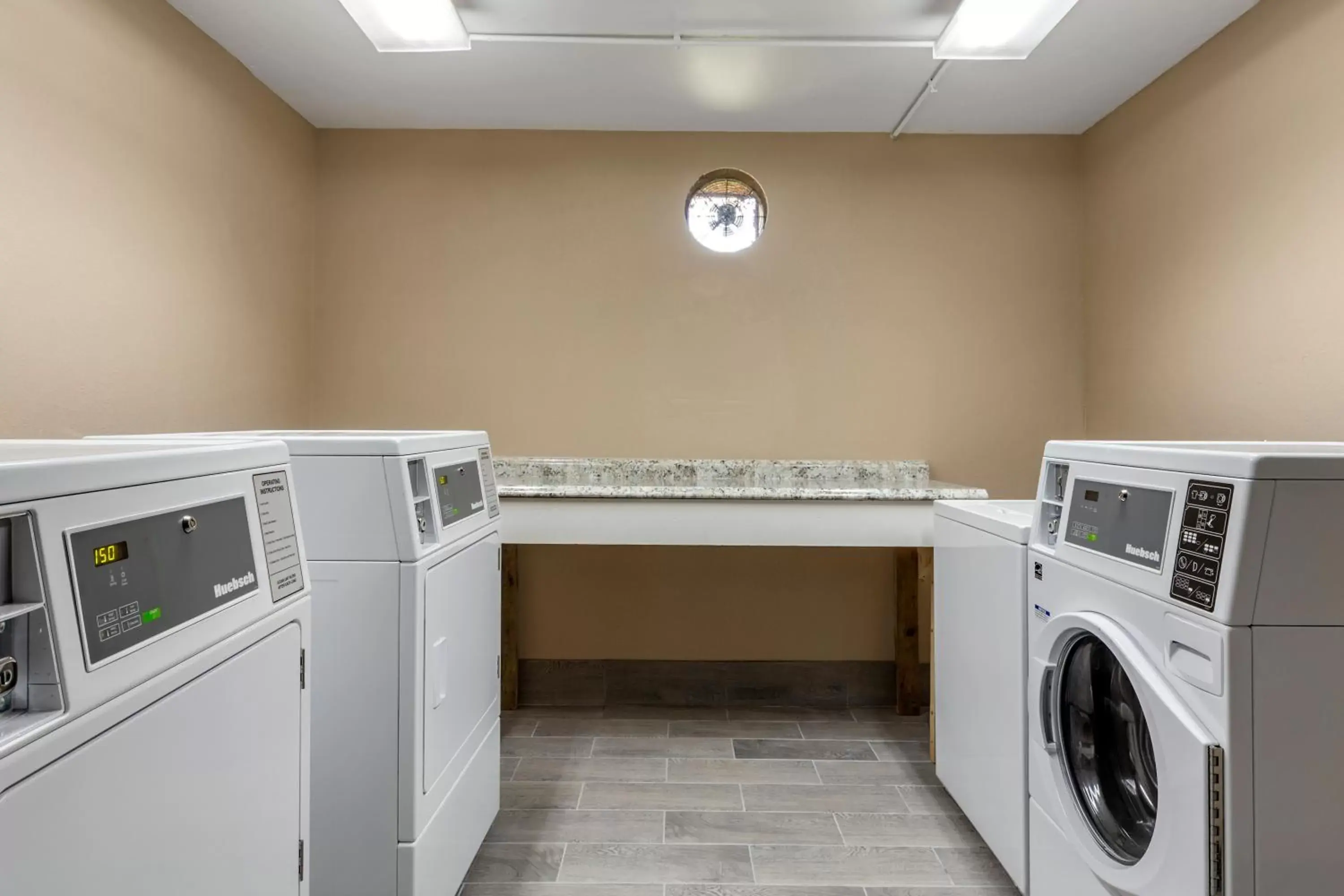 laundry, Kitchen/Kitchenette in Quality Inn & Suites Spring Lake - Fayetteville Near Fort Liberty