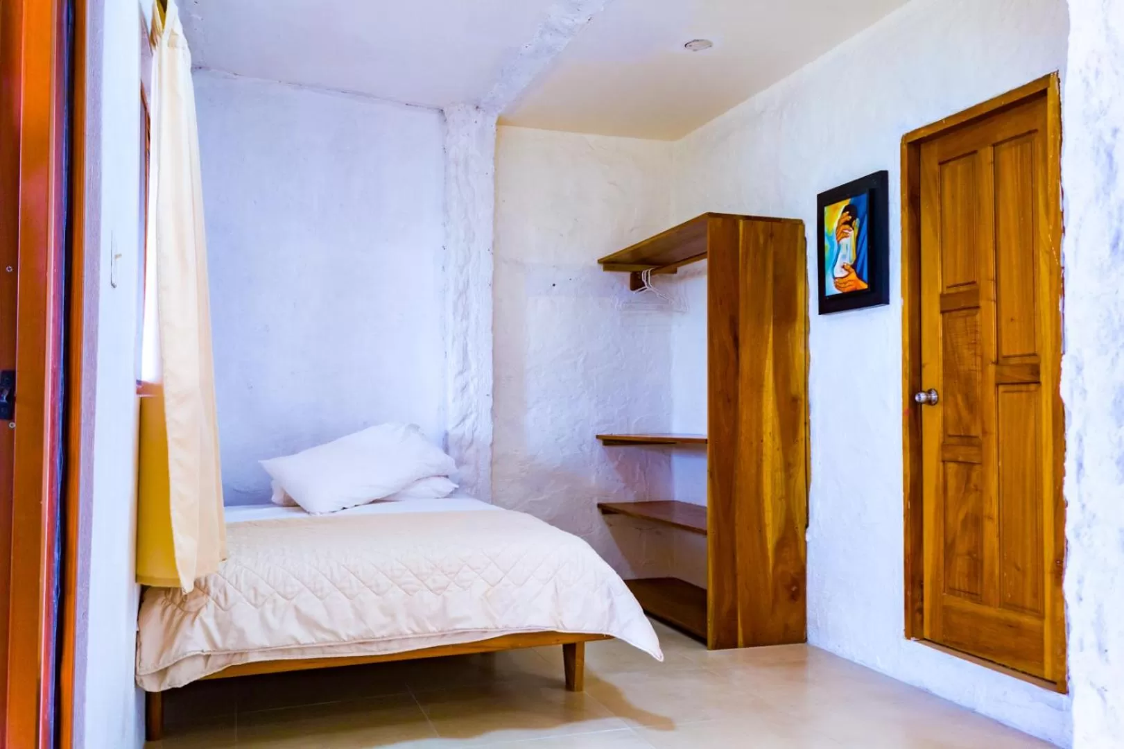 Bed in Royal Galápagos Inn