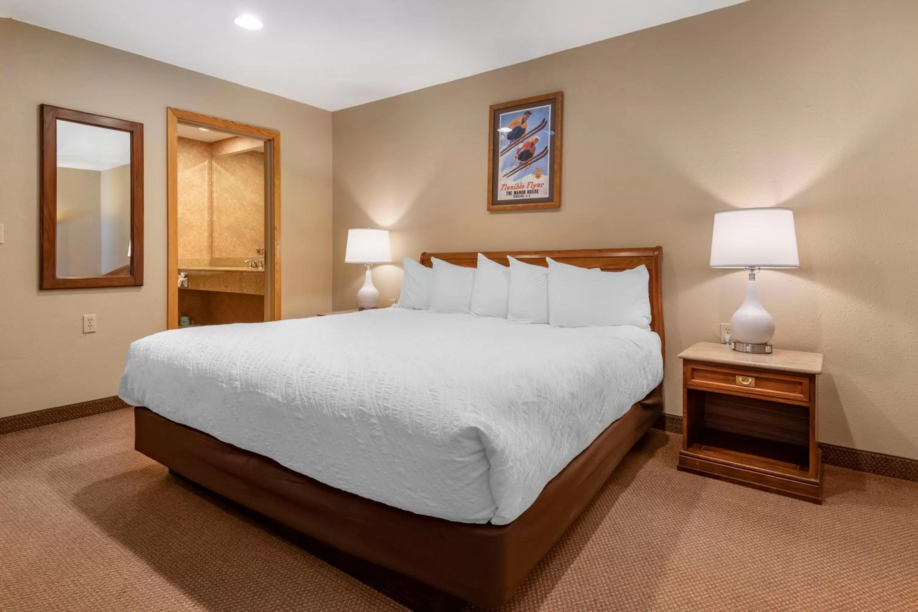 Bed in Mountain Edge Suites at Sunapee, an Ascend Collection Hotel