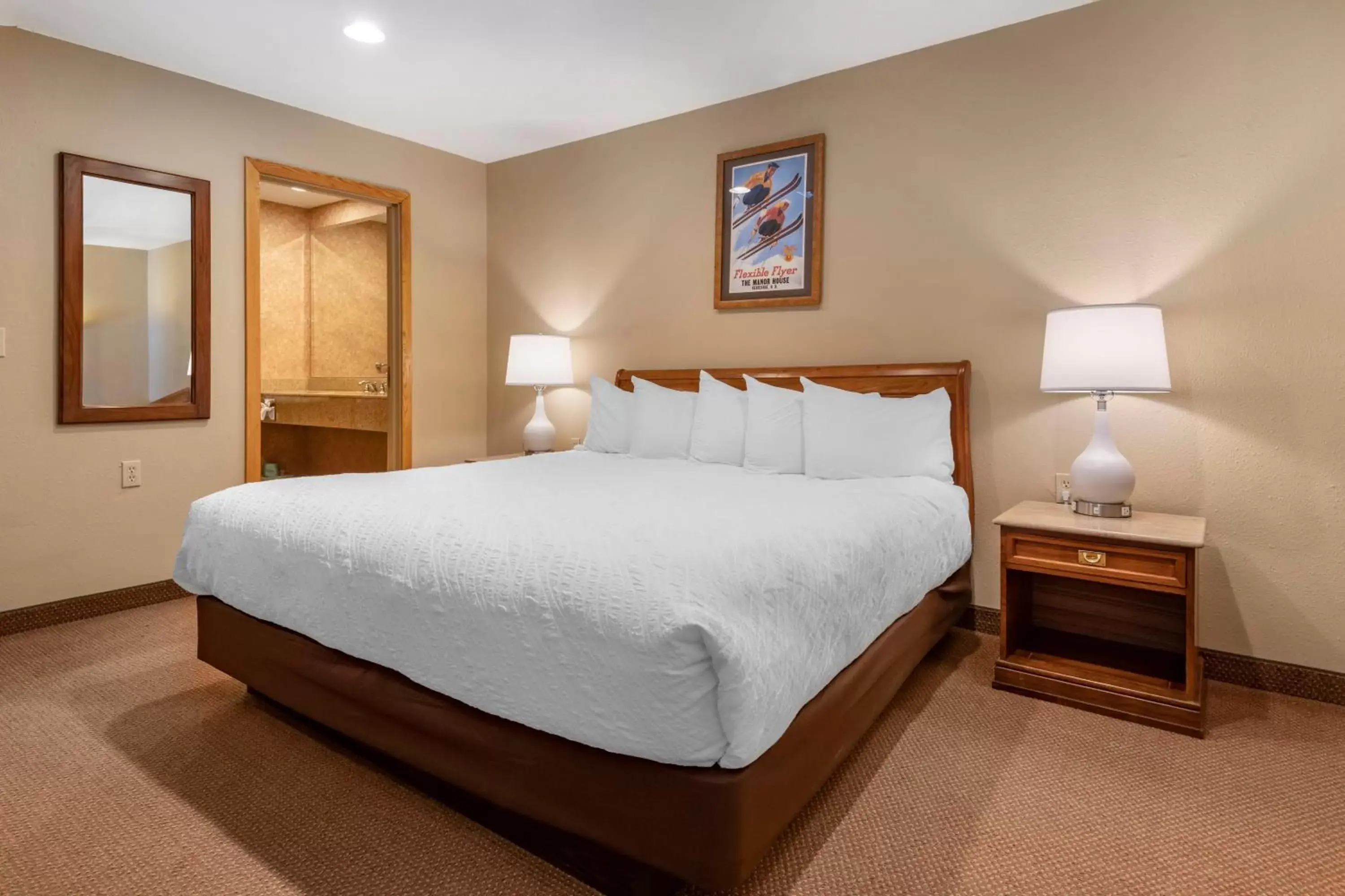 Bed in Mountain Edge Suites at Sunapee, Ascend Hotel Collection