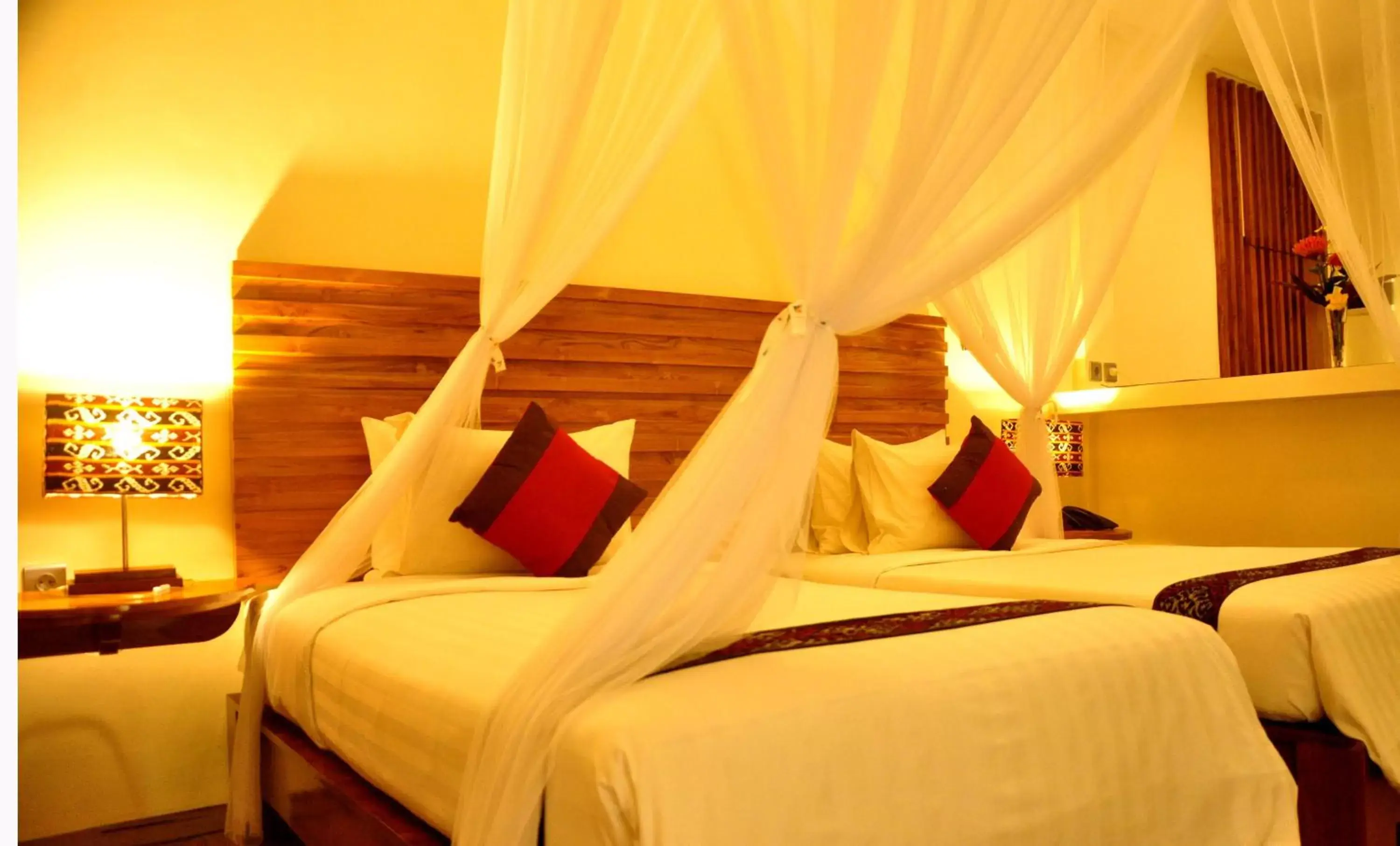 Bed in Puri Sari Beach Hotel