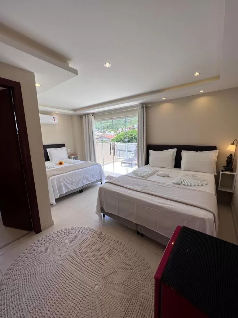 Bed in Pousada Arraial Tropical