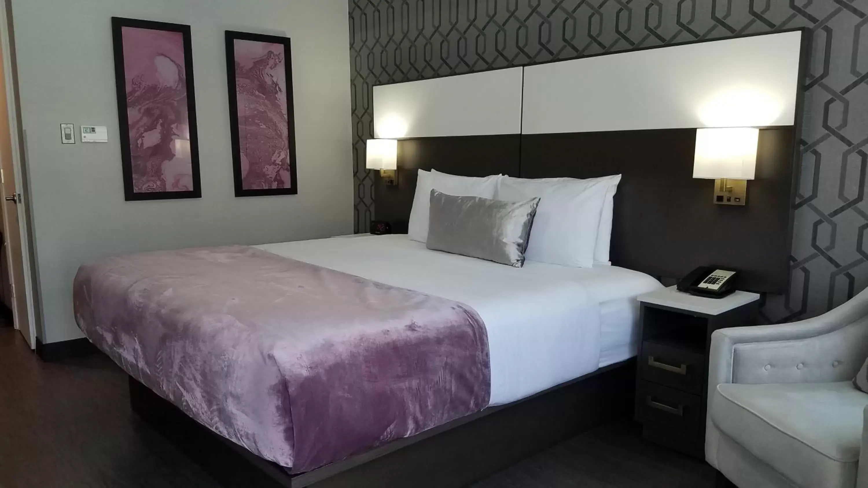 Bed in Sunset West Hotel, SureStay Collection By Best Western