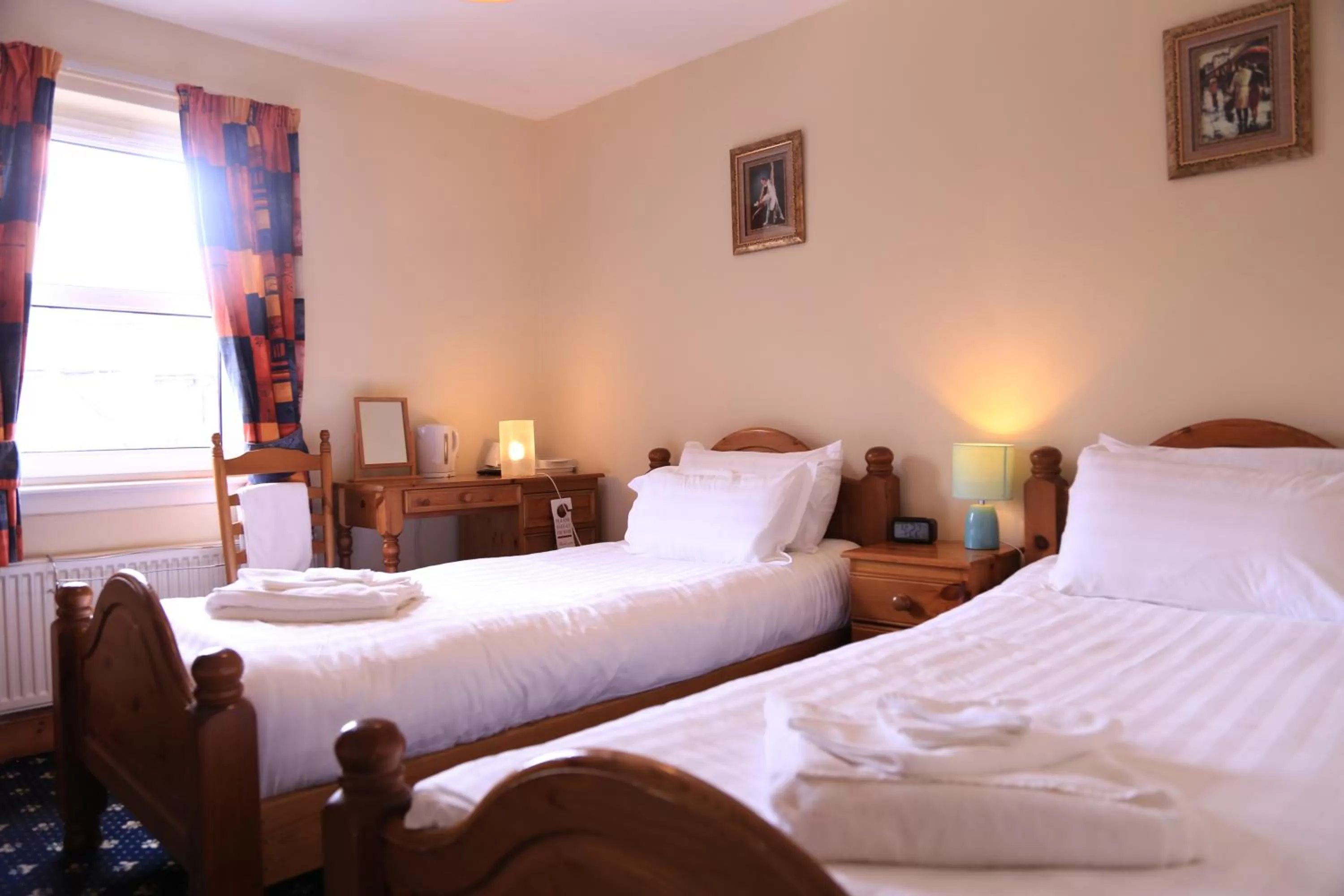 Bed in Twin Lions Hotel