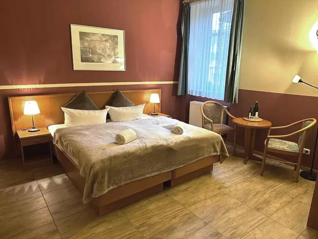 Bed in Altstadthotel Ilsenburg Bed in Altstadthotel Ilsenburg