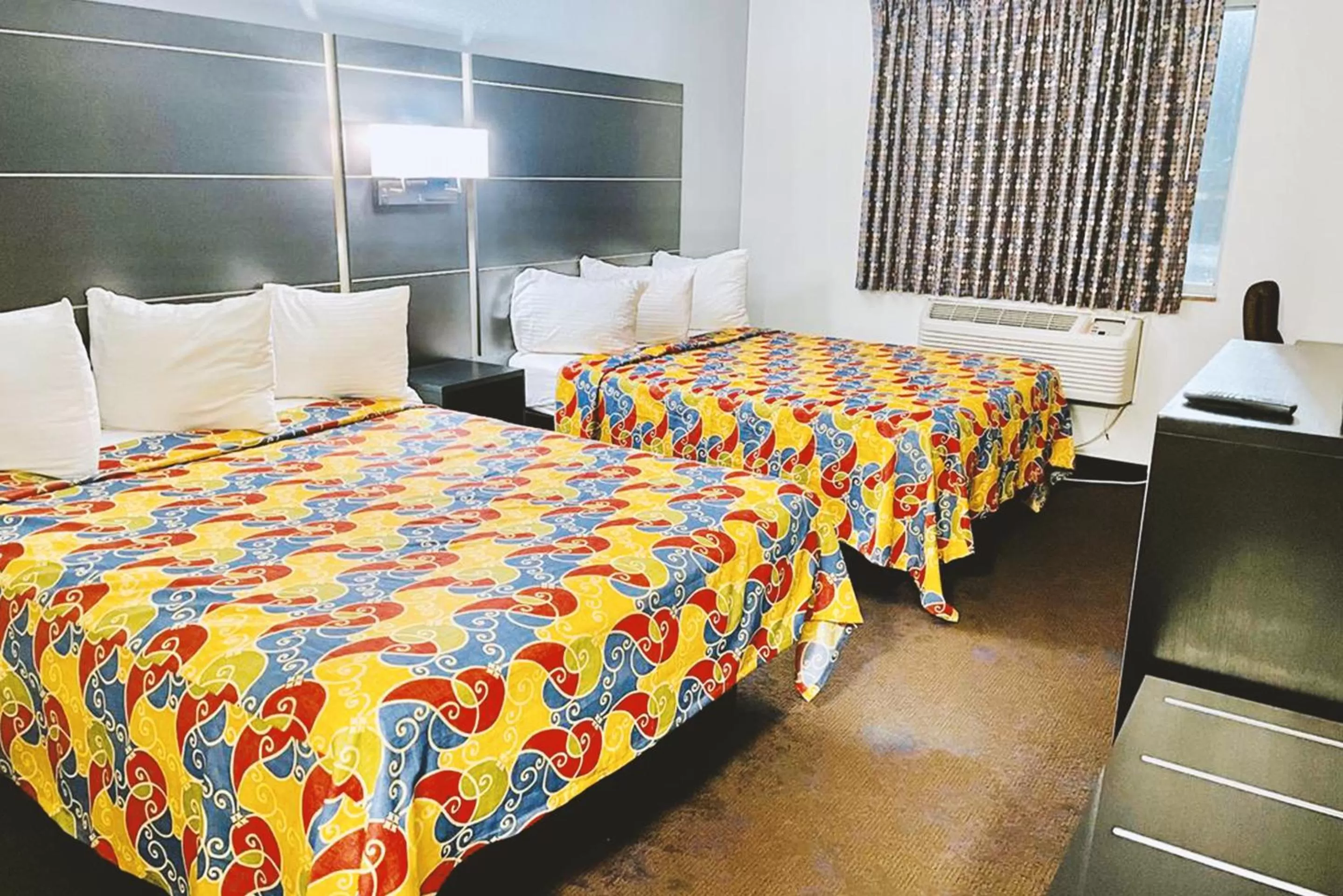 Bed in Coratel Inn & Suites by Jasper Northfield