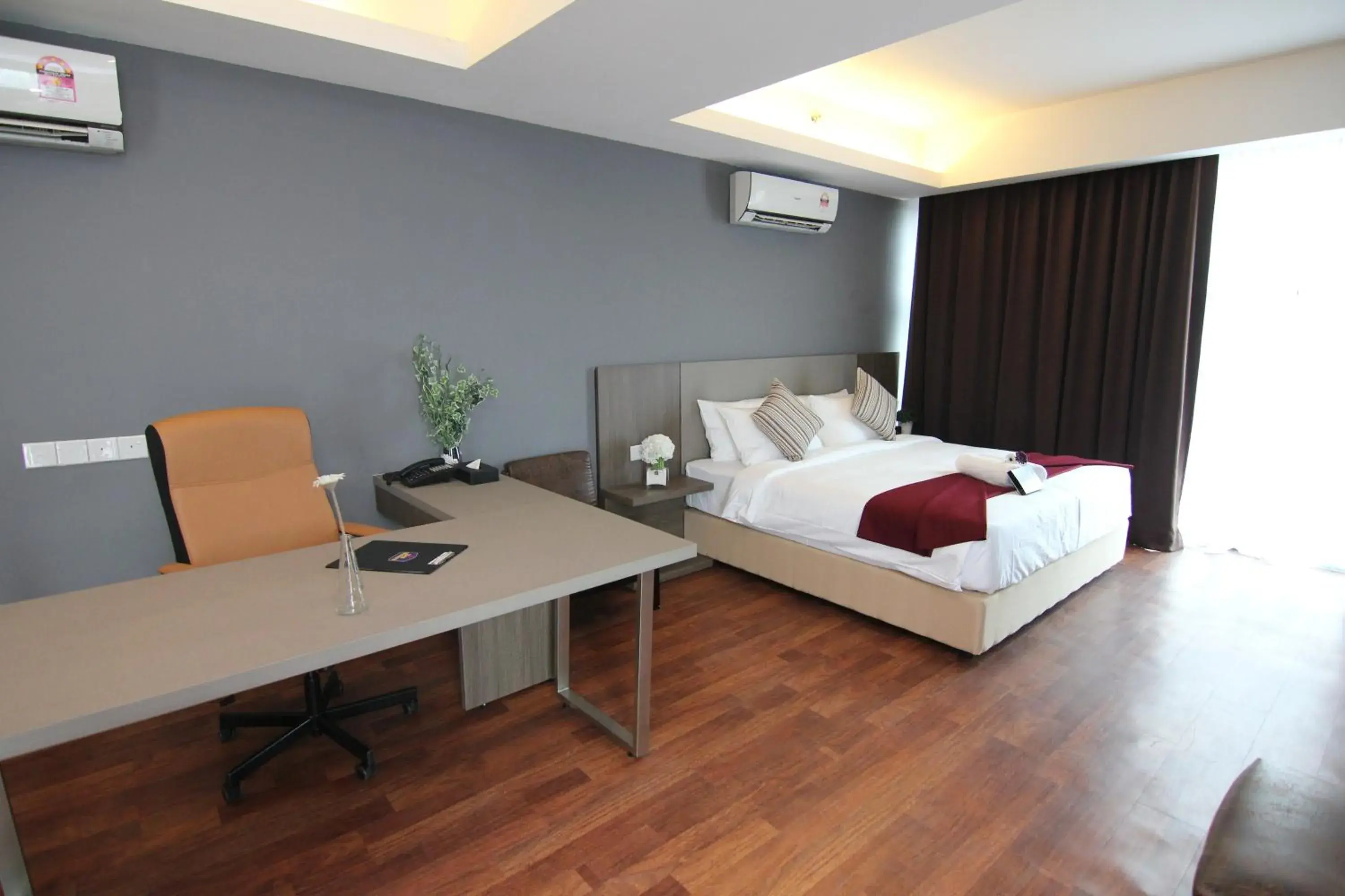 Bed in Nexus Business Suite Hotel