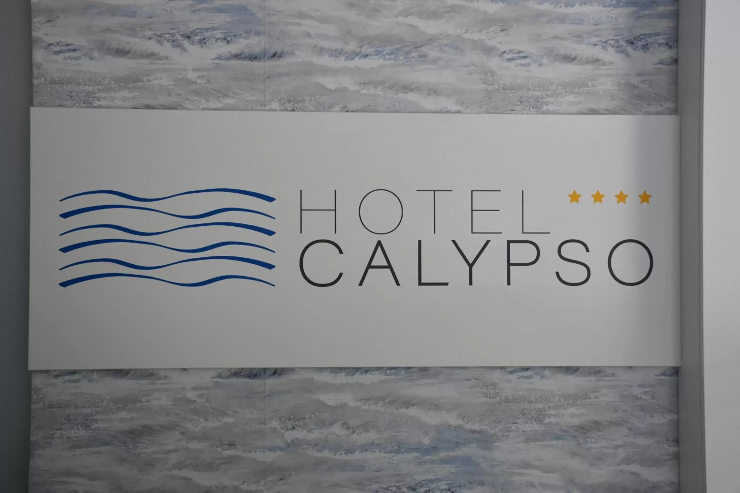 Property logo or sign in Hotel Calypso