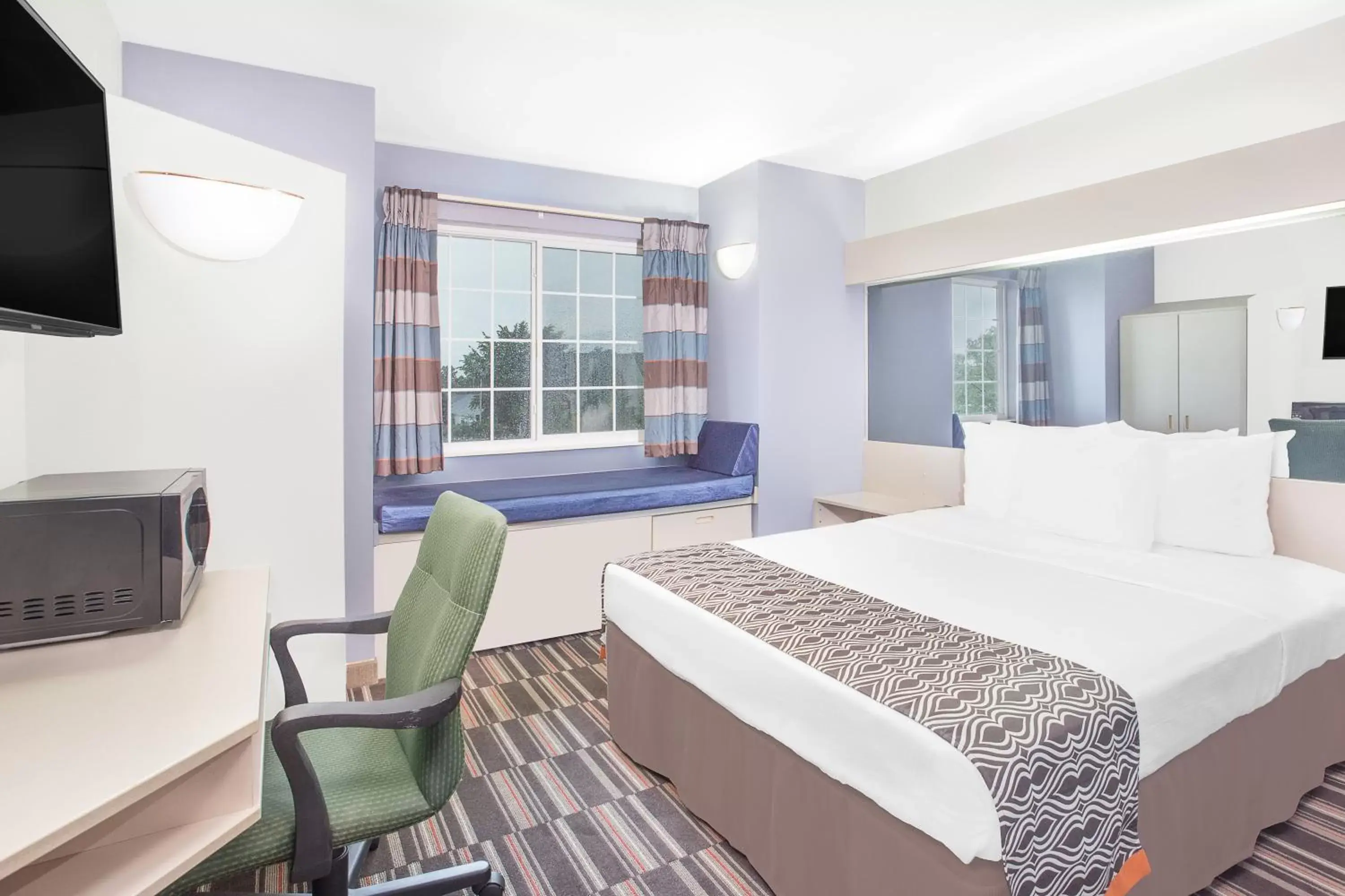 Living room, Bed in Microtel Inn and Suites by Wyndham Appleton Living room, Bed in Microtel Inn and Suites by Wyndham Appleton