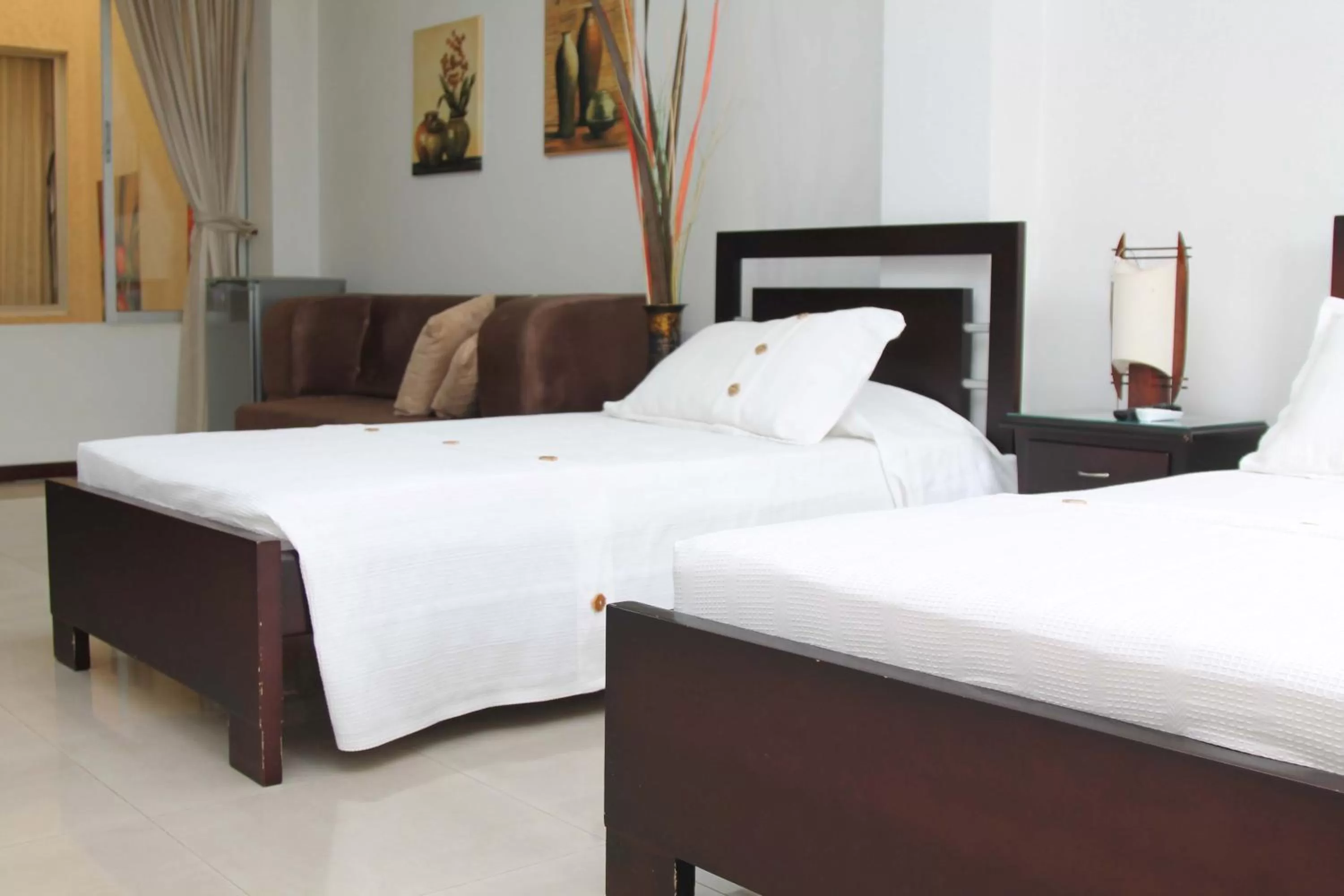 Bed in Pampalinda Hotel