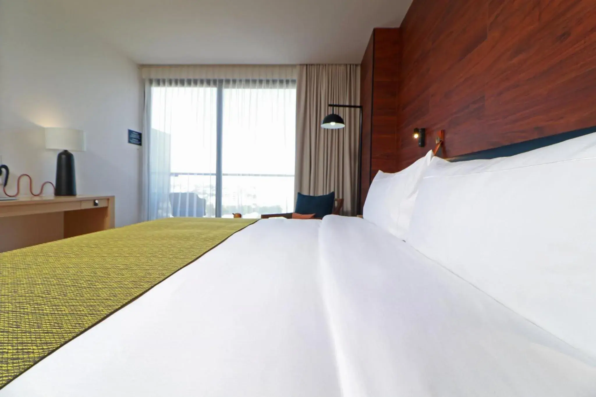 Photo of the whole room, Bed in voco Guadalajara Neruda, an IHG Hotel