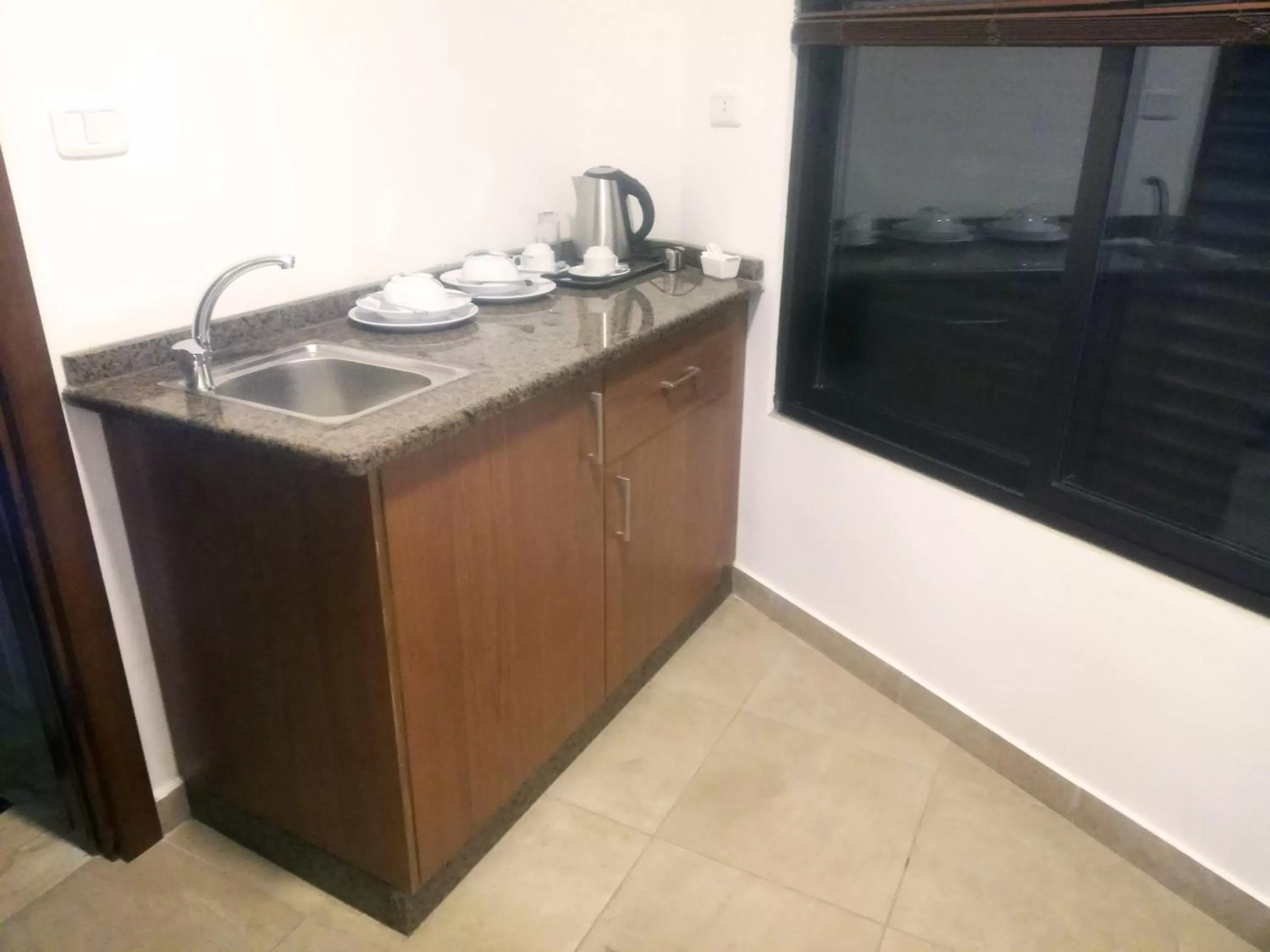 Kitchen or kitchenette in سما عمان للشقق الفندقية Sama Amman Hotel Apartments