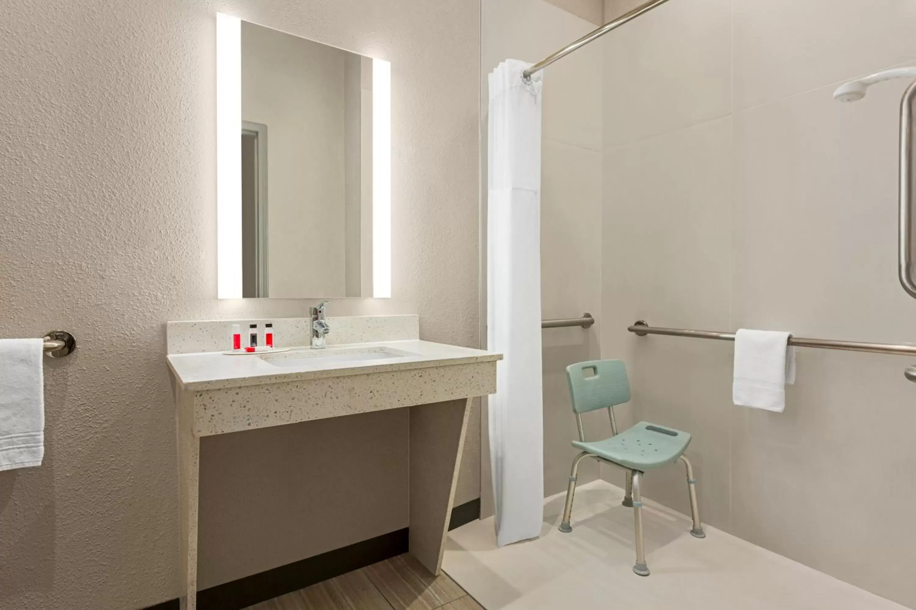 Bathroom in Days Inn & Suites by Wyndham Greater Tomball