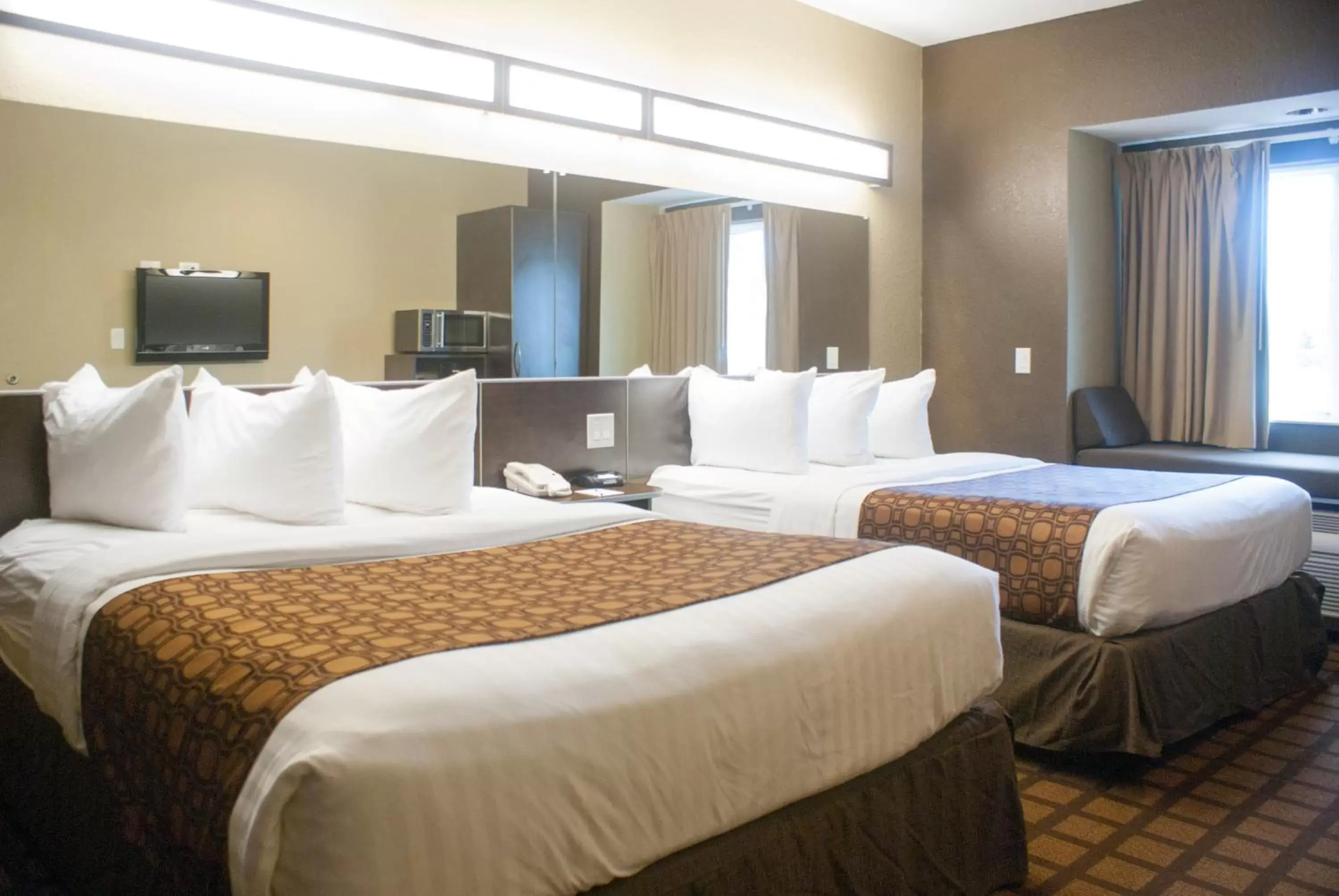 Bed in Microtel Inn & Suites by Wyndham Jacksonville Airport