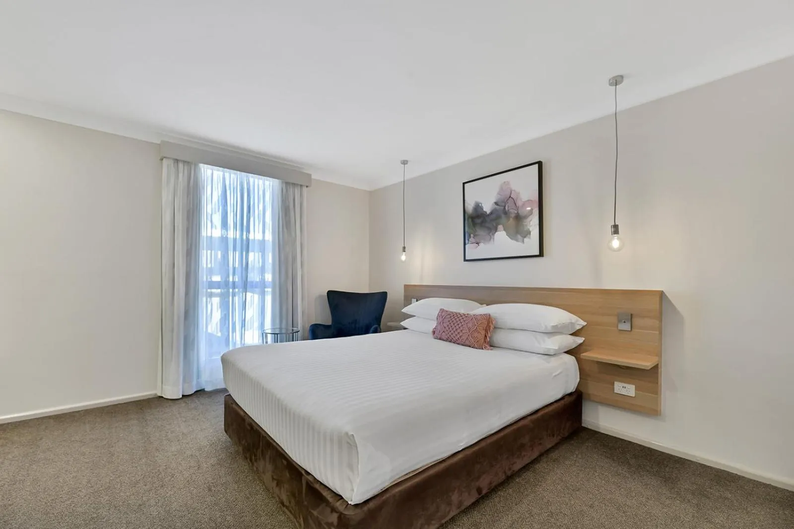 Bed in Central Caleula Motor Lodge