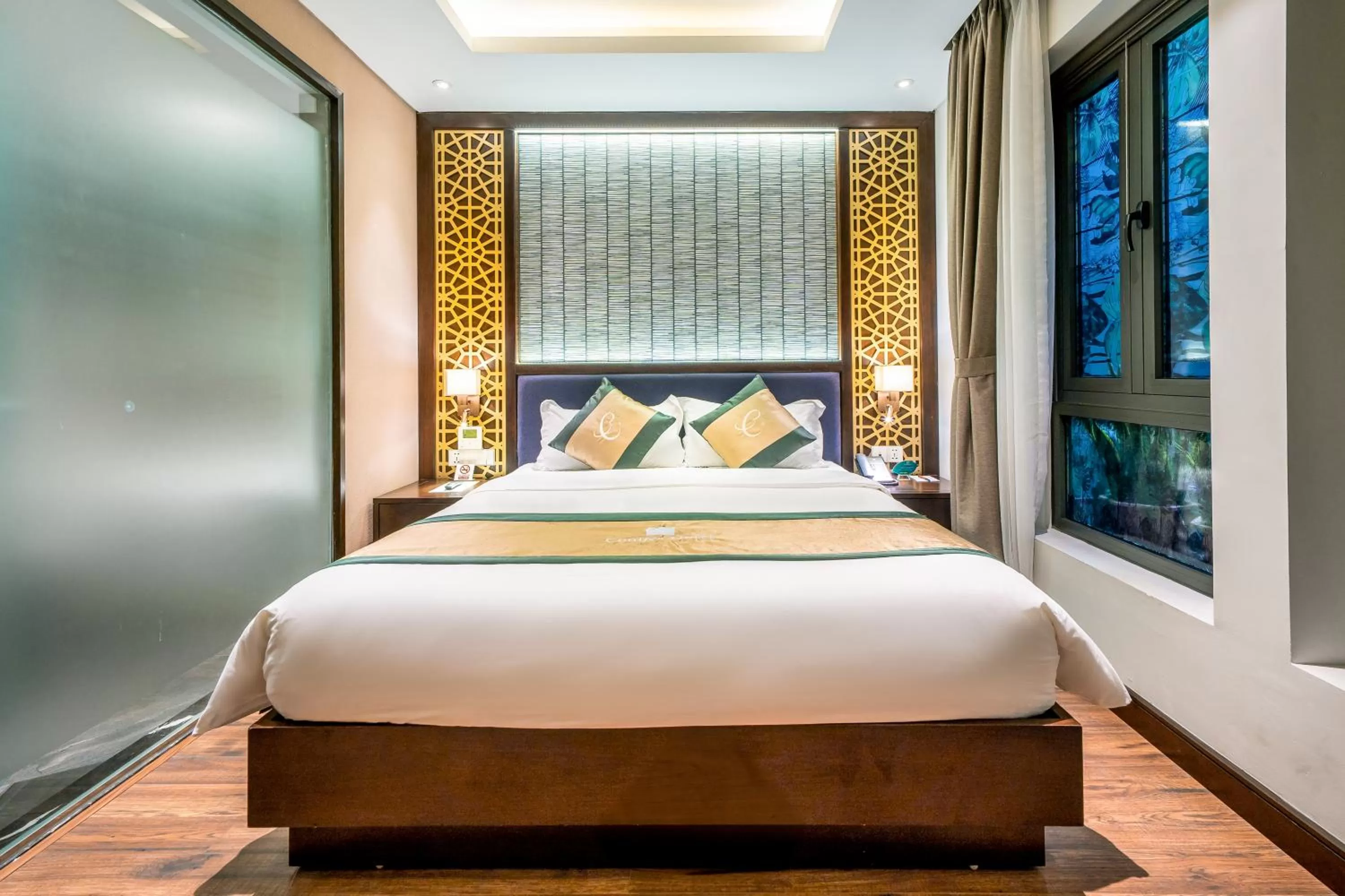 Bed in Conifer Grand Hotel