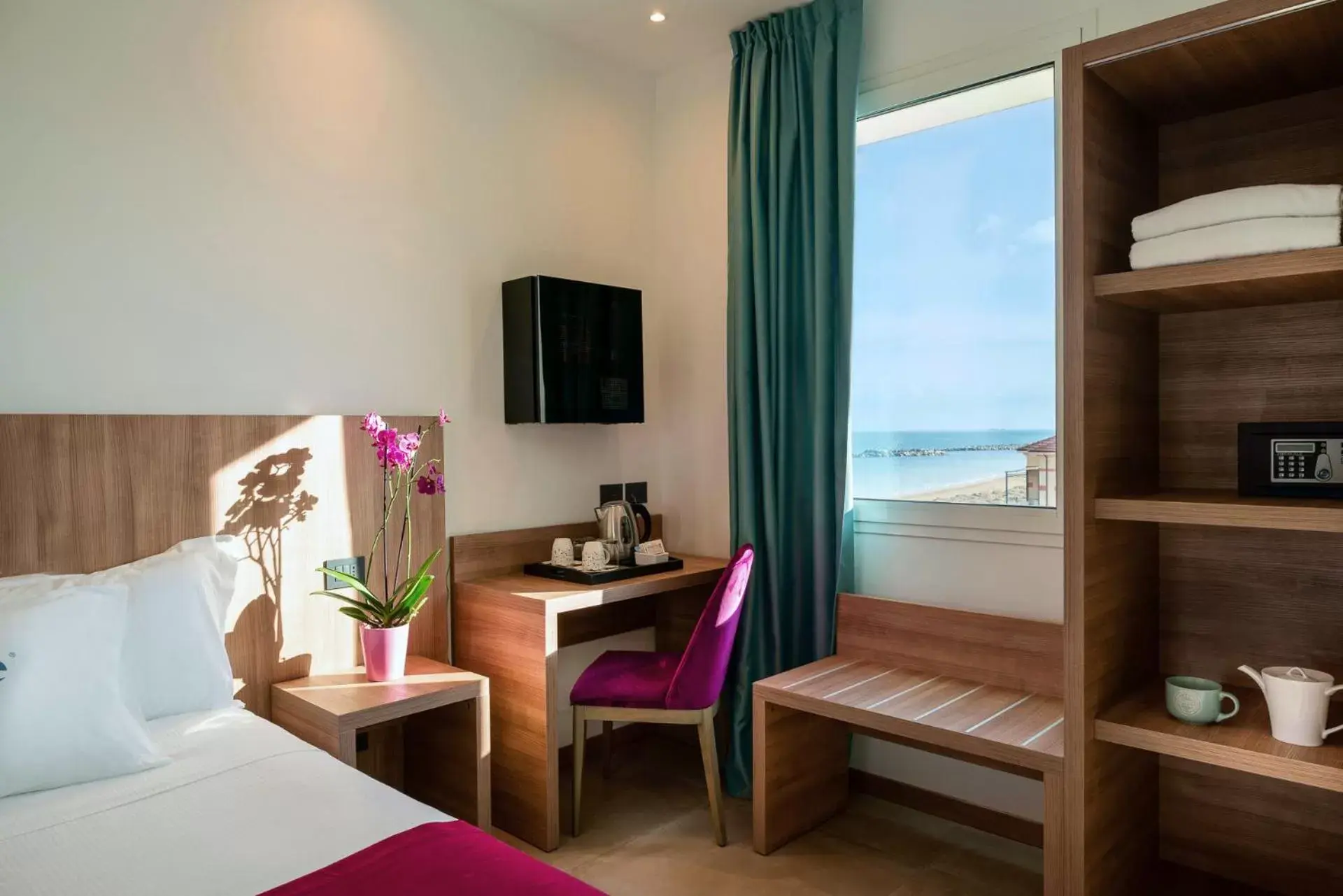 View (from property/room), TV/Entertainment Center in You & Me Beach Hotel