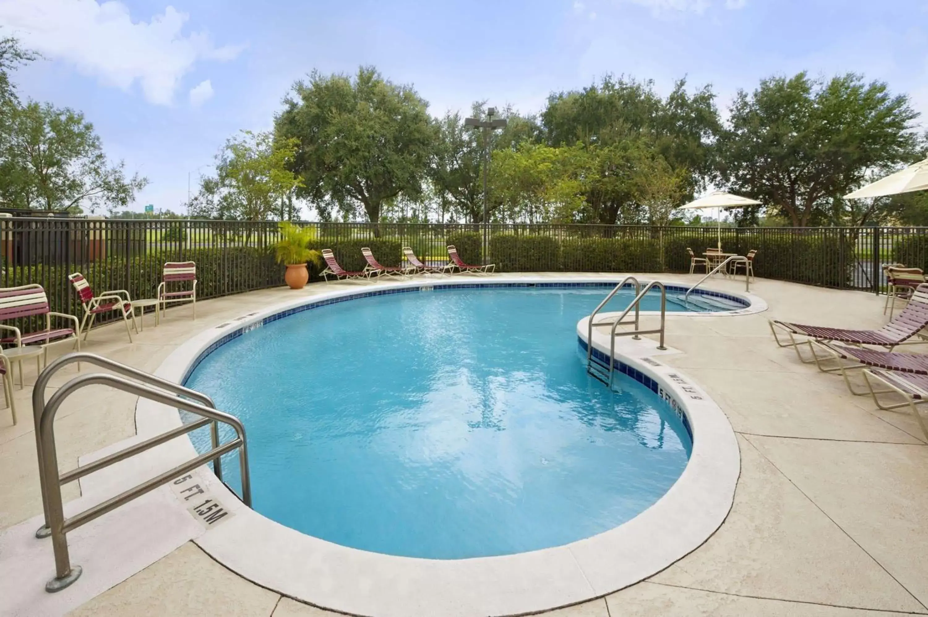 On site, Swimming Pool in Ramada by Wyndham Suites Orlando Airport