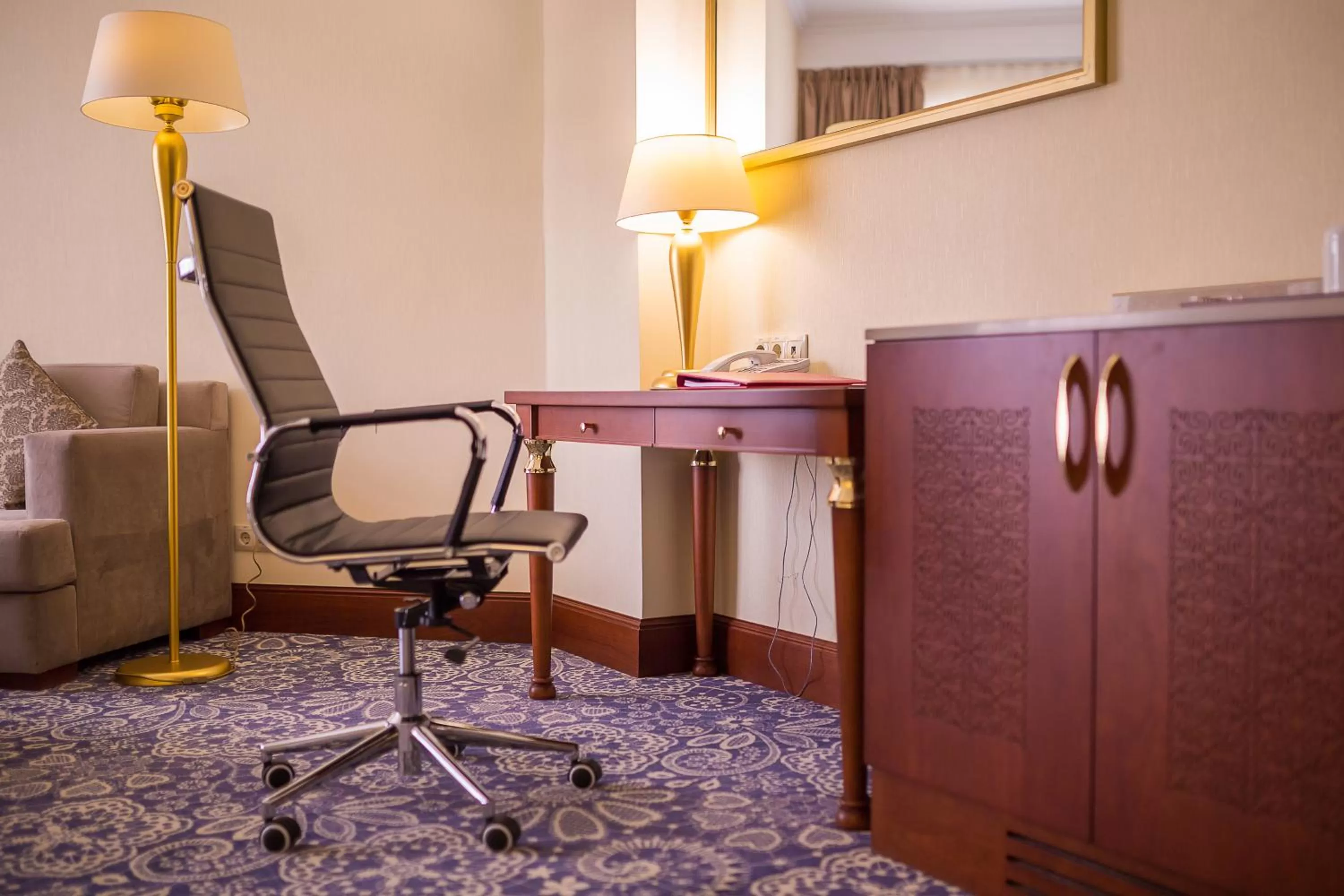 Bedroom in Ramada by Wyndham Almaty