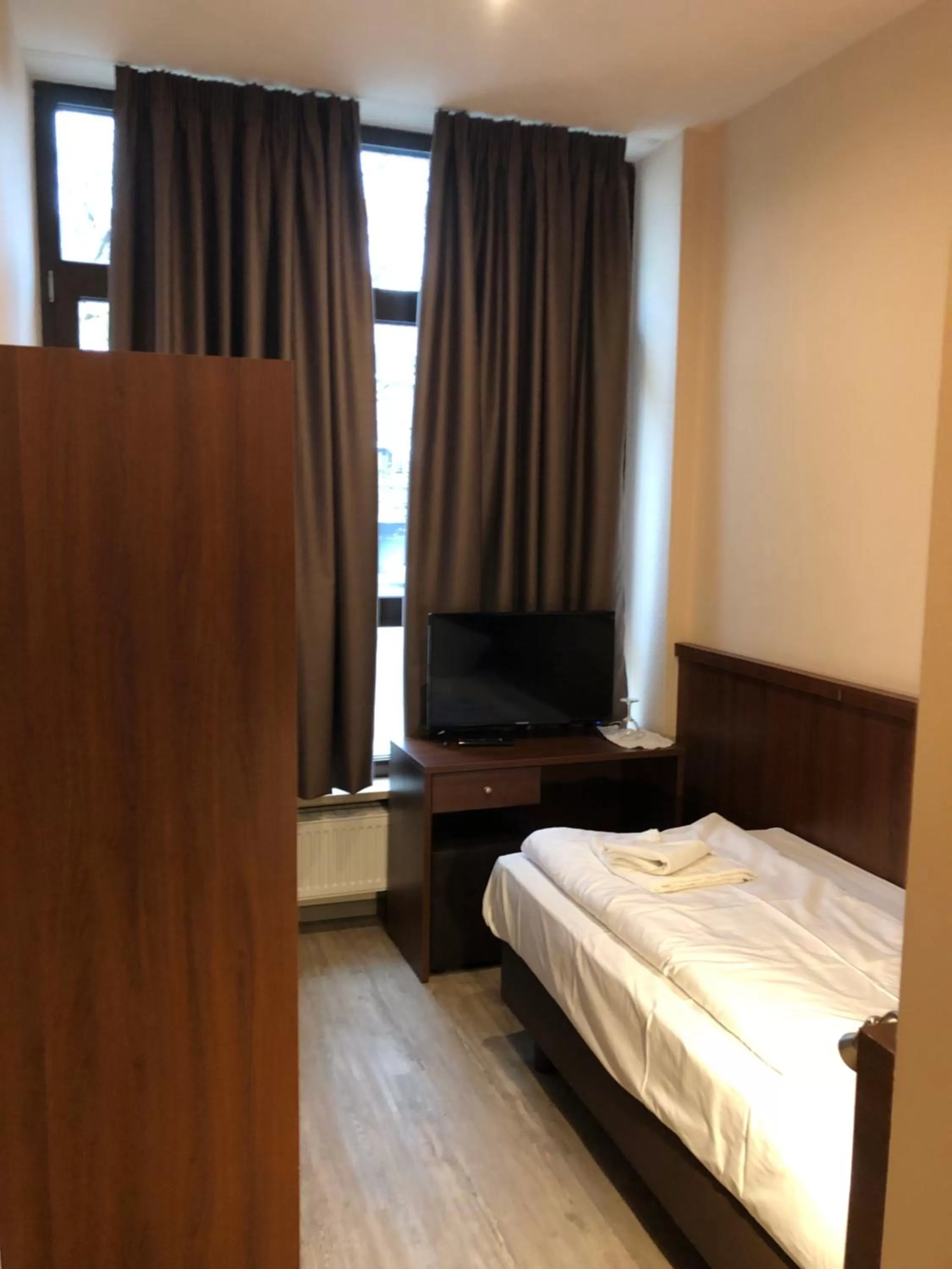 Bed in Hotel Poseidon