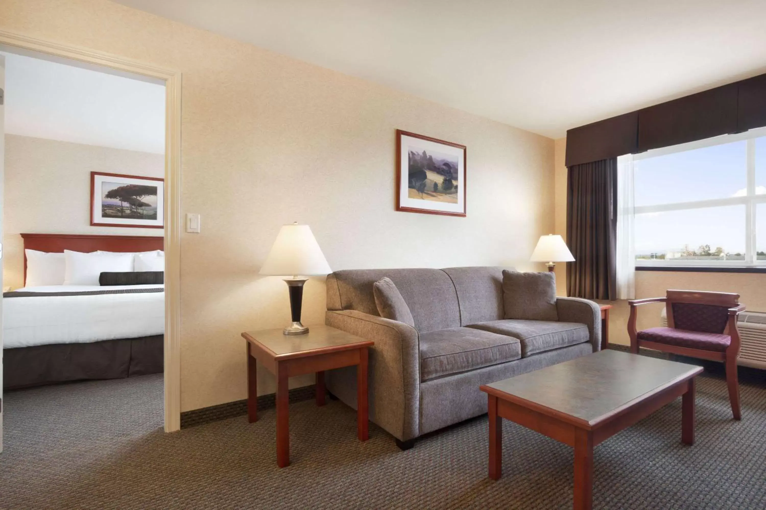 Photo of the whole room, Seating Area in Days Inn & Suites by Wyndham Langley