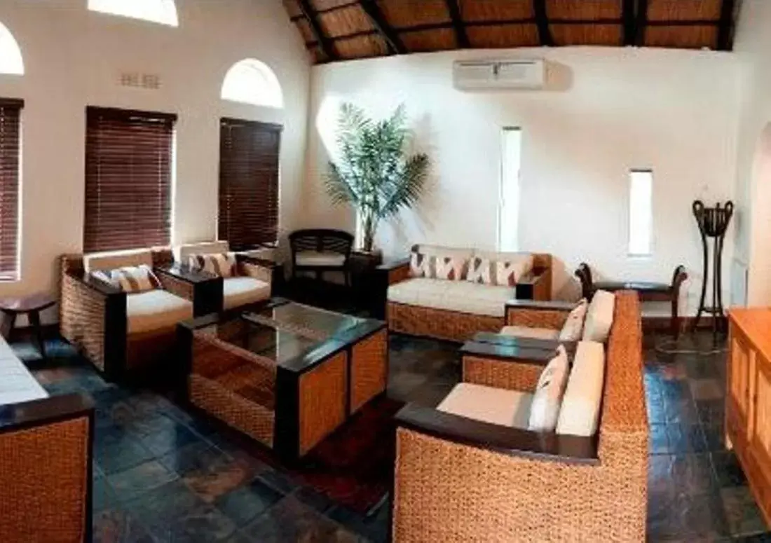 Communal lounge/ TV room, Seating Area in Rustenburg Boutique Hotel