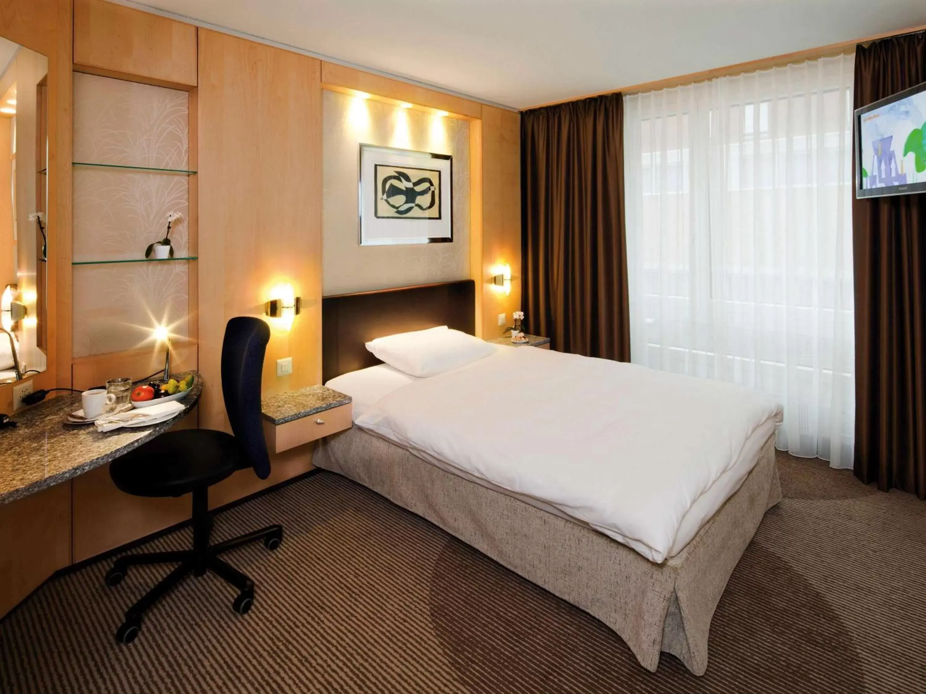 Photo of the whole room, Bed in Mövenpick Hotel Zürich-Regensdorf