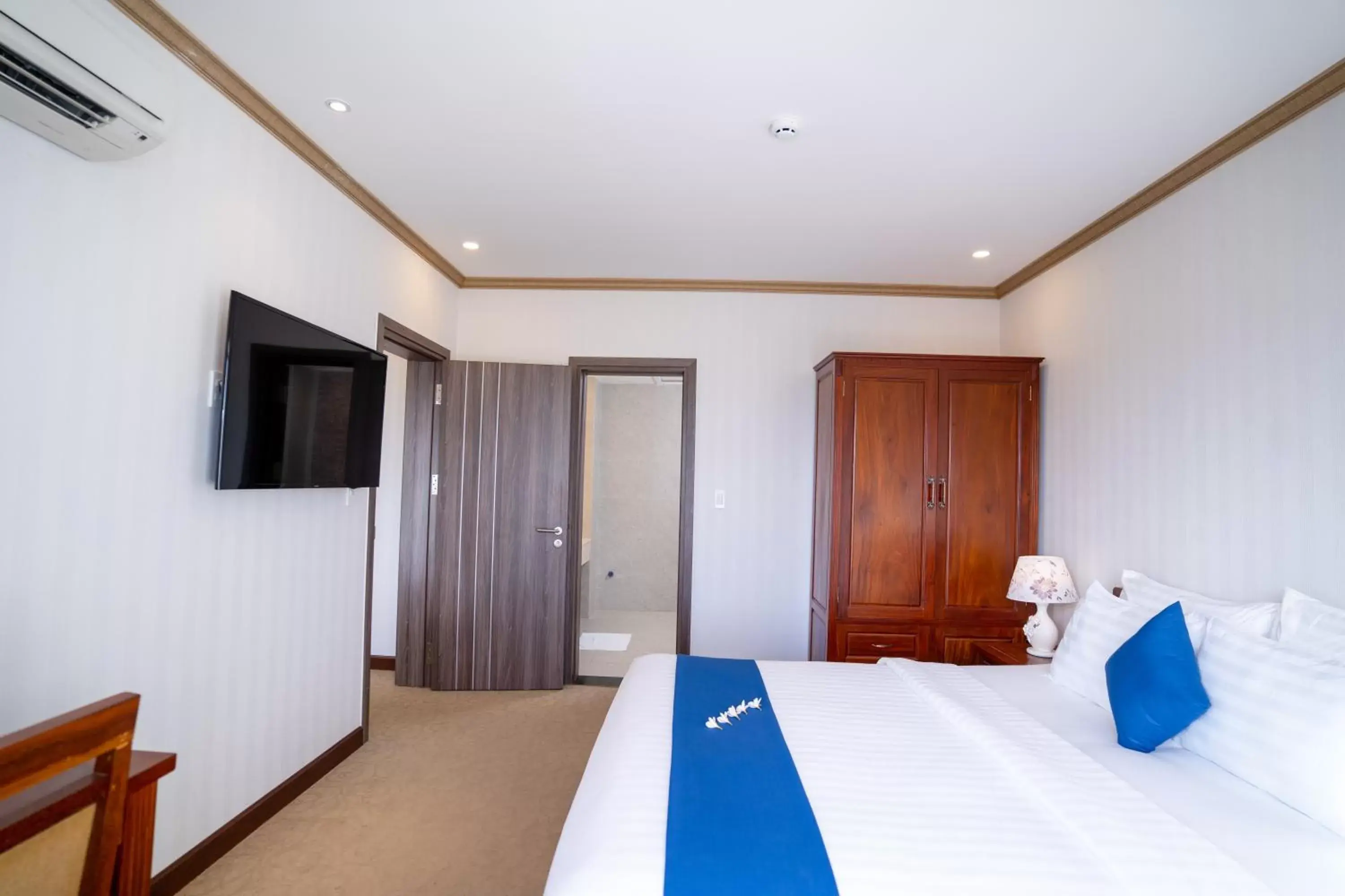 Bed, TV/Entertainment Center in Navy Hotel Cam Ranh