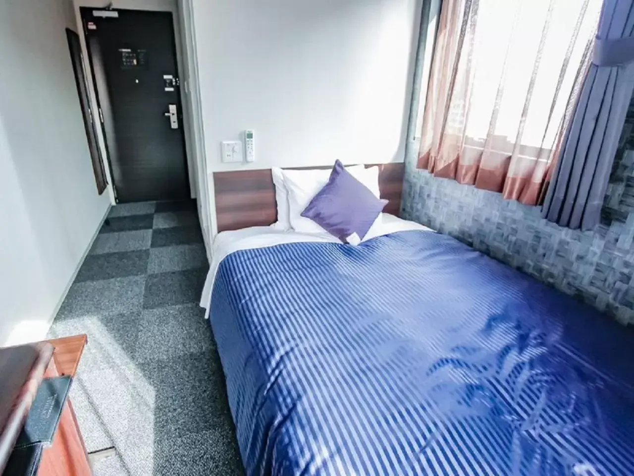 Bed in HOTEL LiVEMAX Osaka Honmachi
