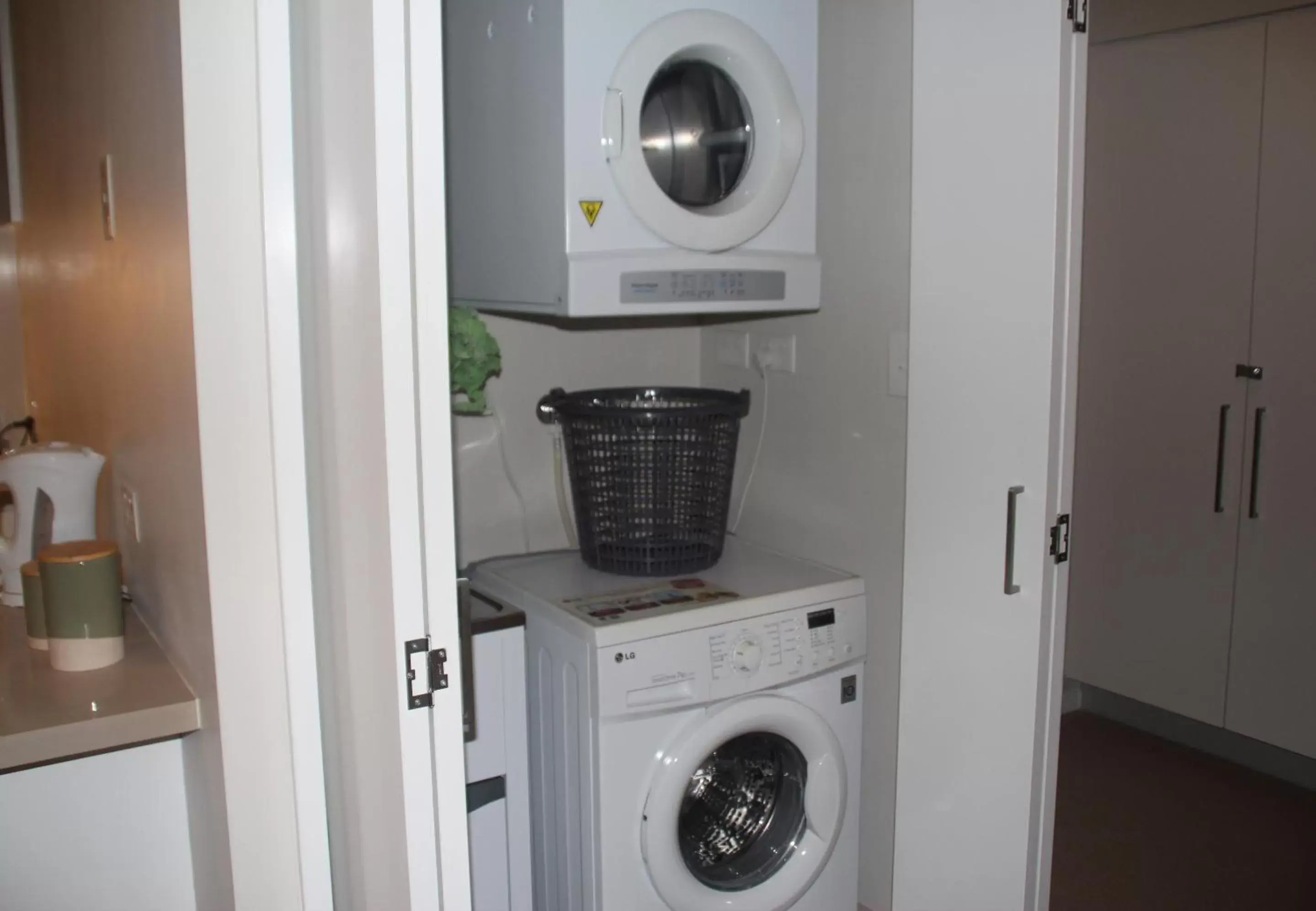 washing machine, Bathroom in Link Portside Wharf Apartment Hotel