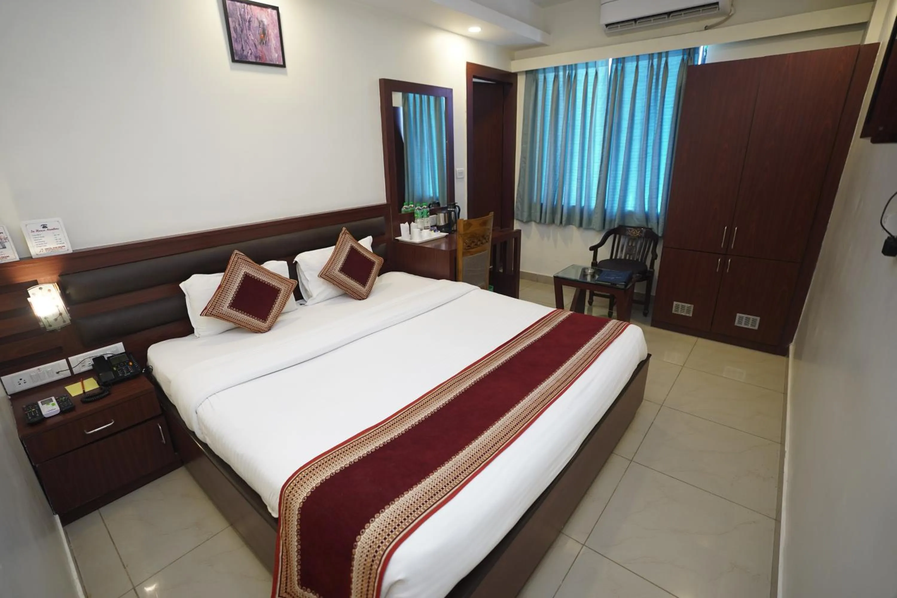 Photo of the whole room, Bed in HOTEL AVN GRAND