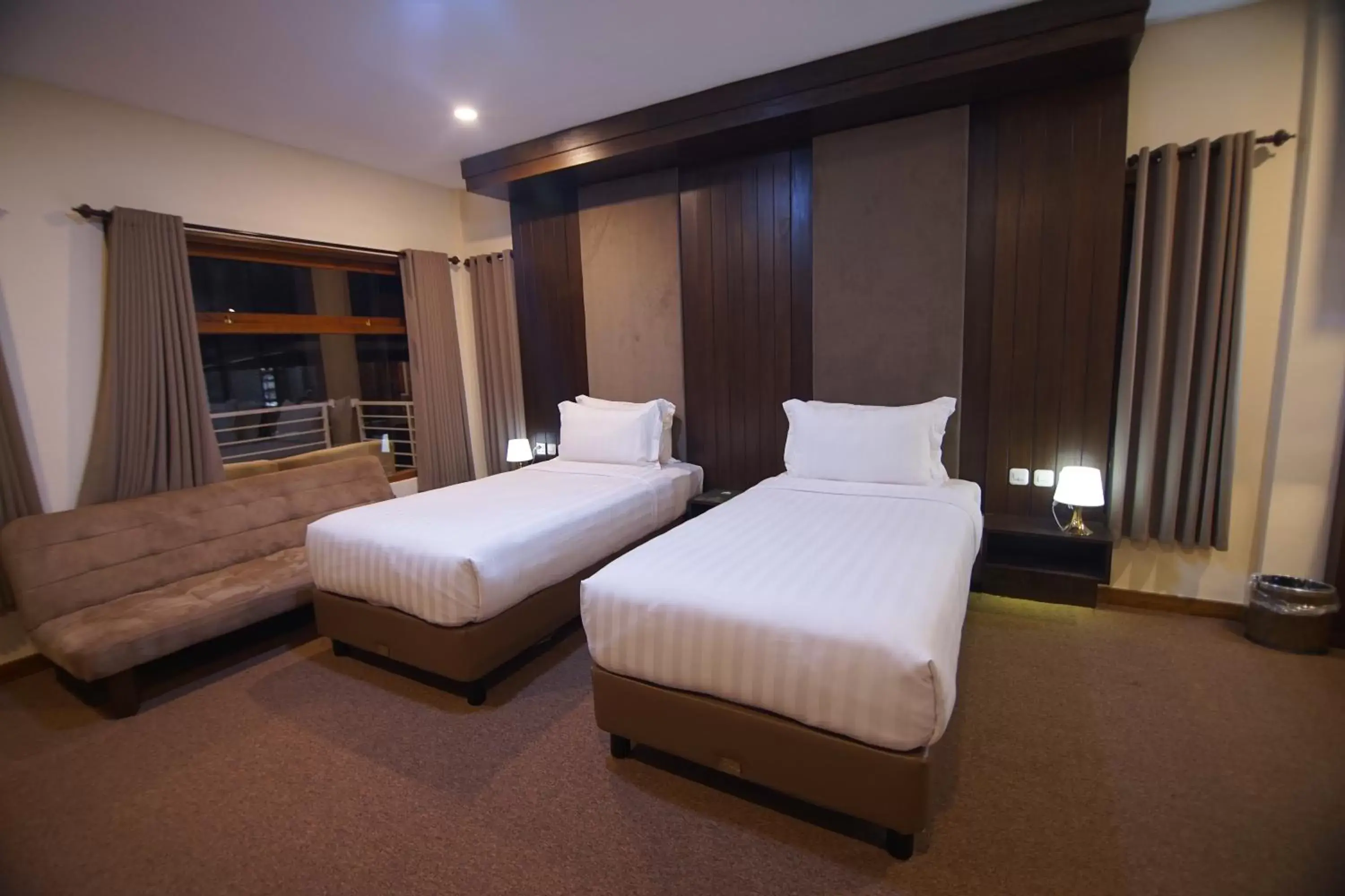 Bed in Grand Harvest Resort & Villas