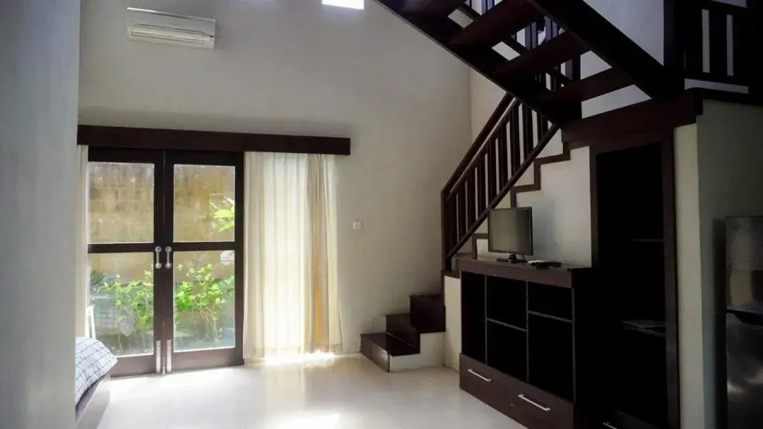 Bedroom, TV/Entertainment Center in The Janan Villa