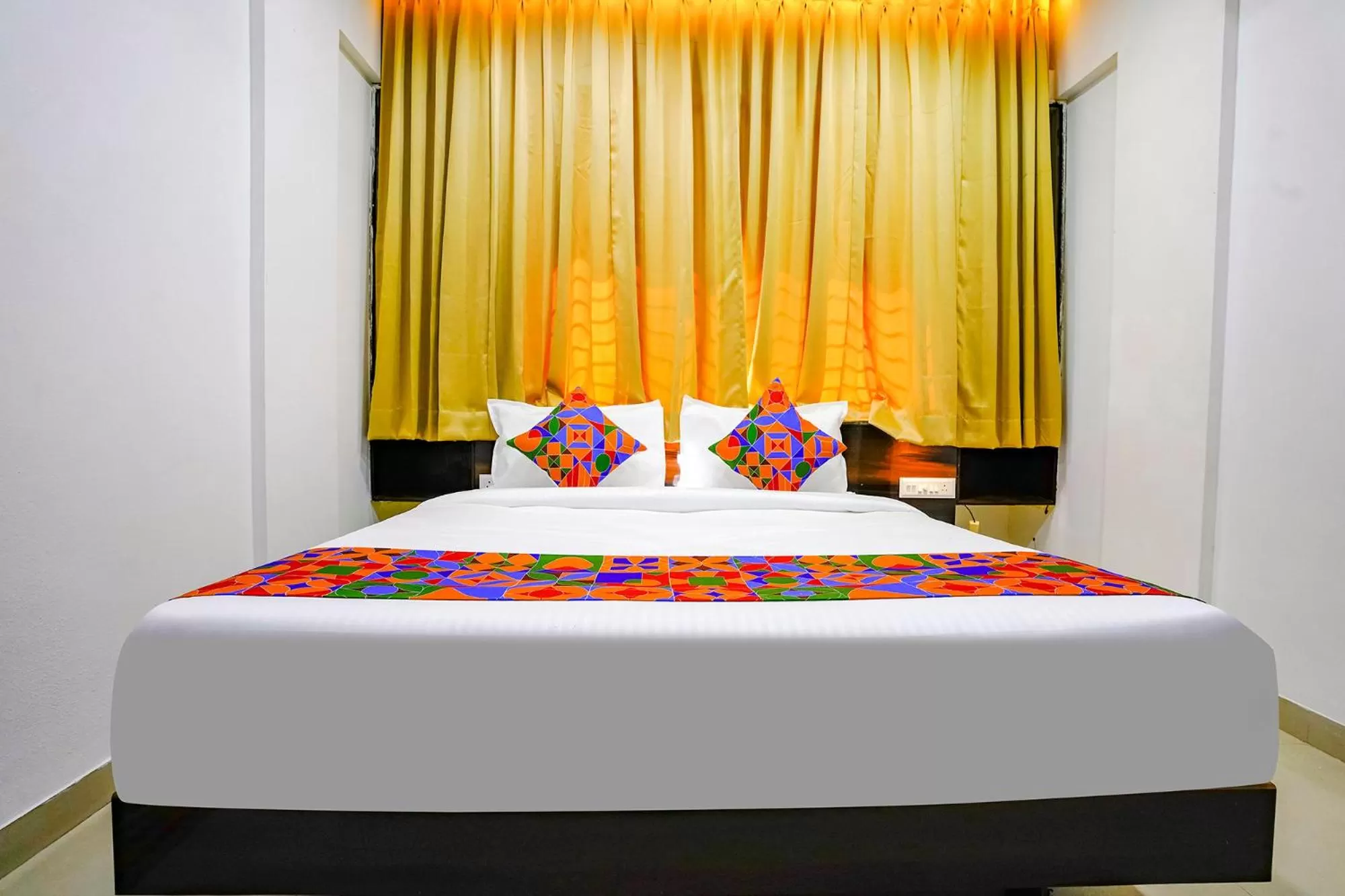 Bed in FabHotel Woods Regency