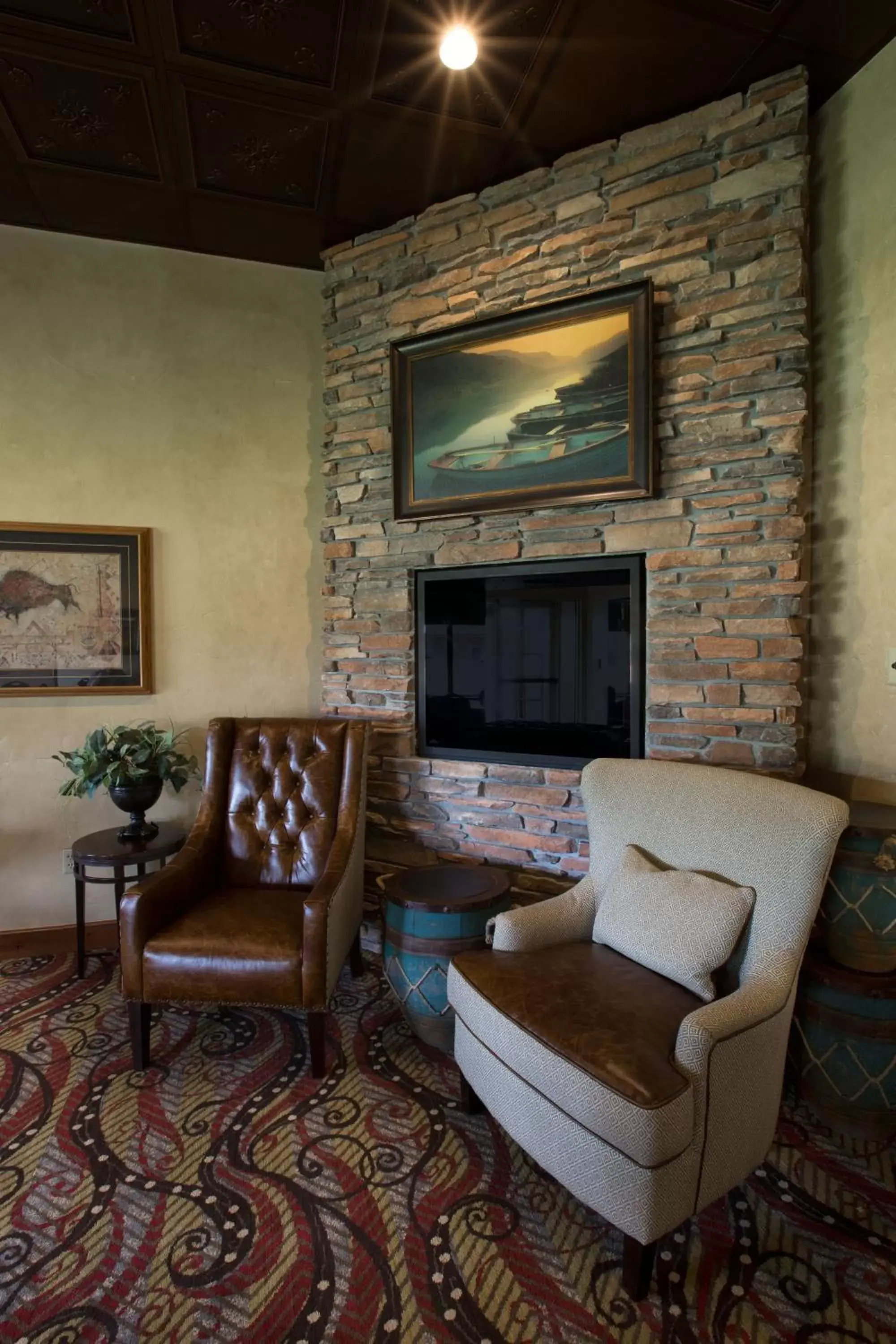 Communal lounge/ TV room, Seating Area in Miles City Hotel & Suites