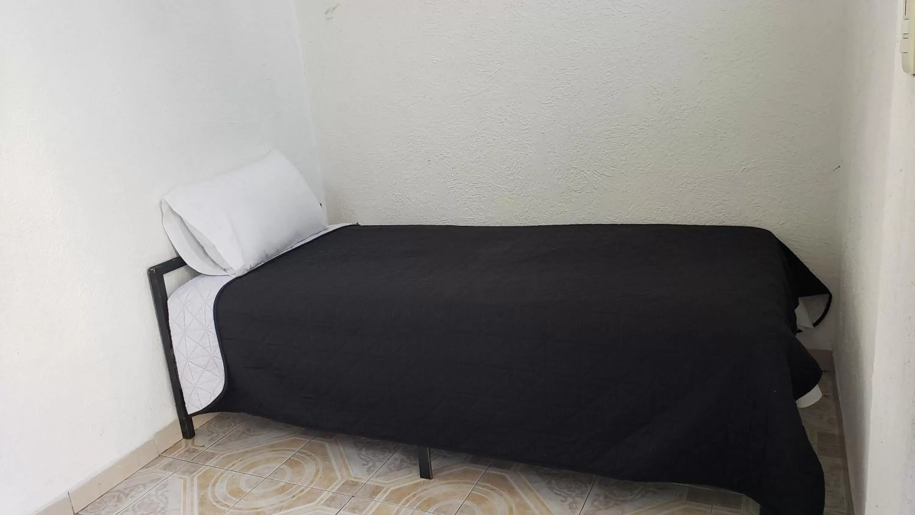 Bed in Hotel Grand Isitia