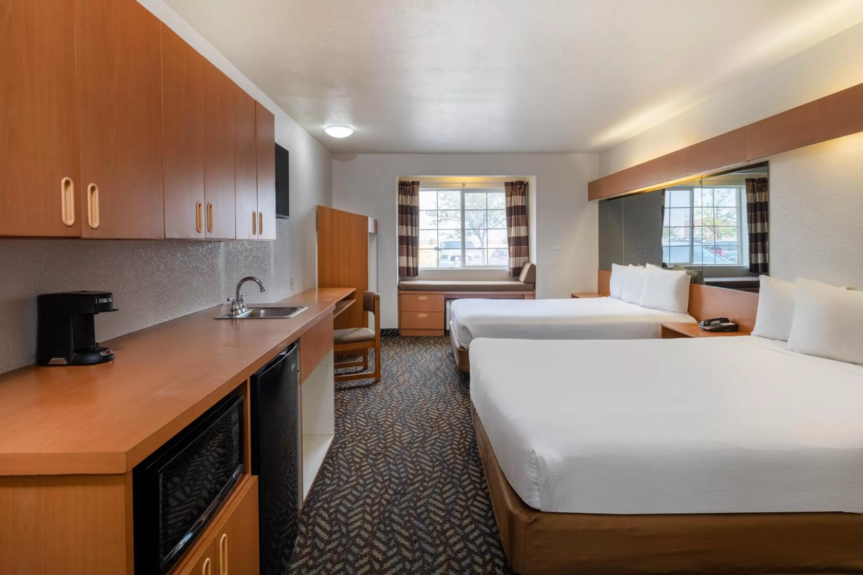 Kitchen or kitchenette, Bed in Microtel Inn & Suites by Wyndham Salt Lake City Airport
