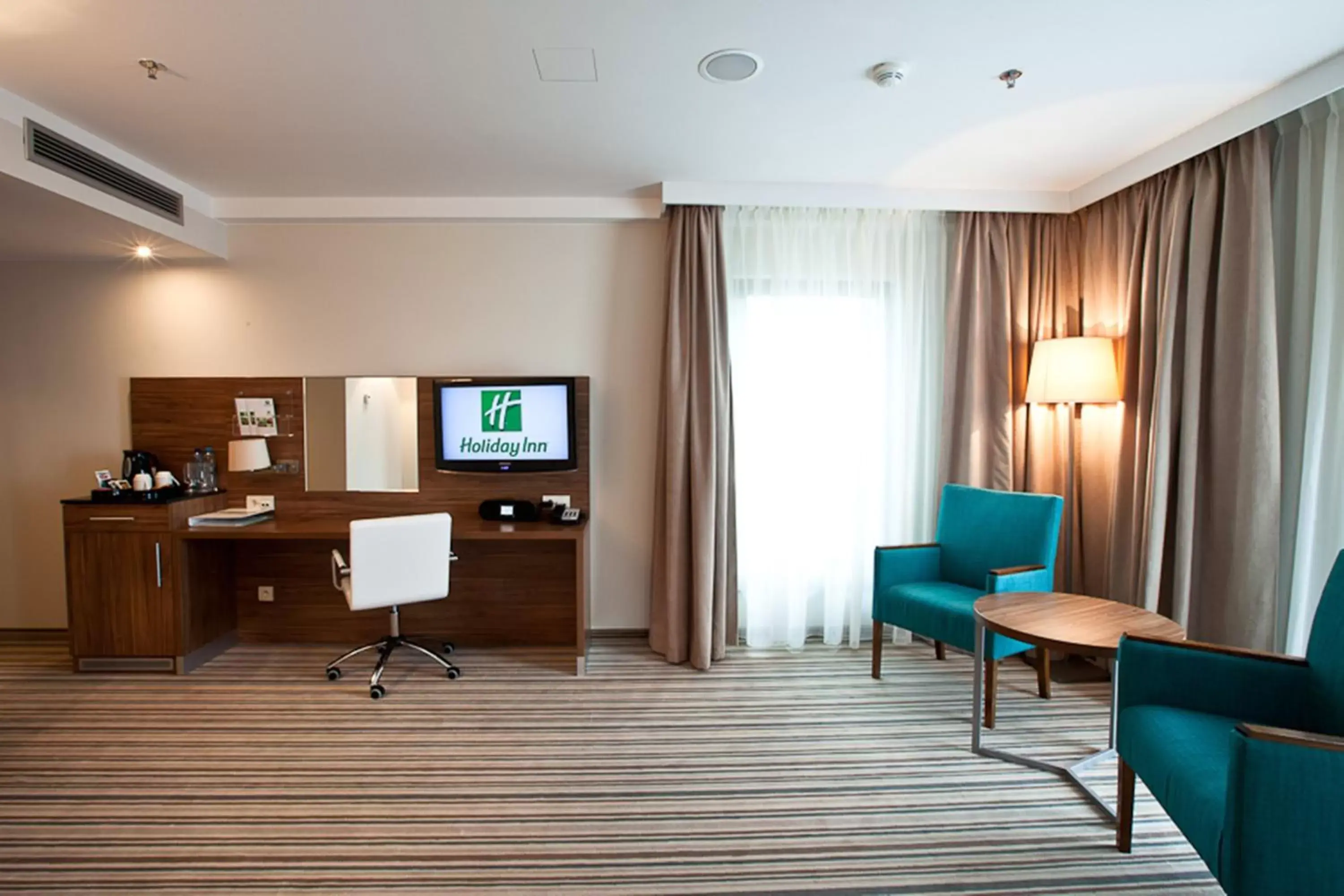 Photo of the whole room, TV/Entertainment Center in Holiday Inn Łódź, an IHG Hotel