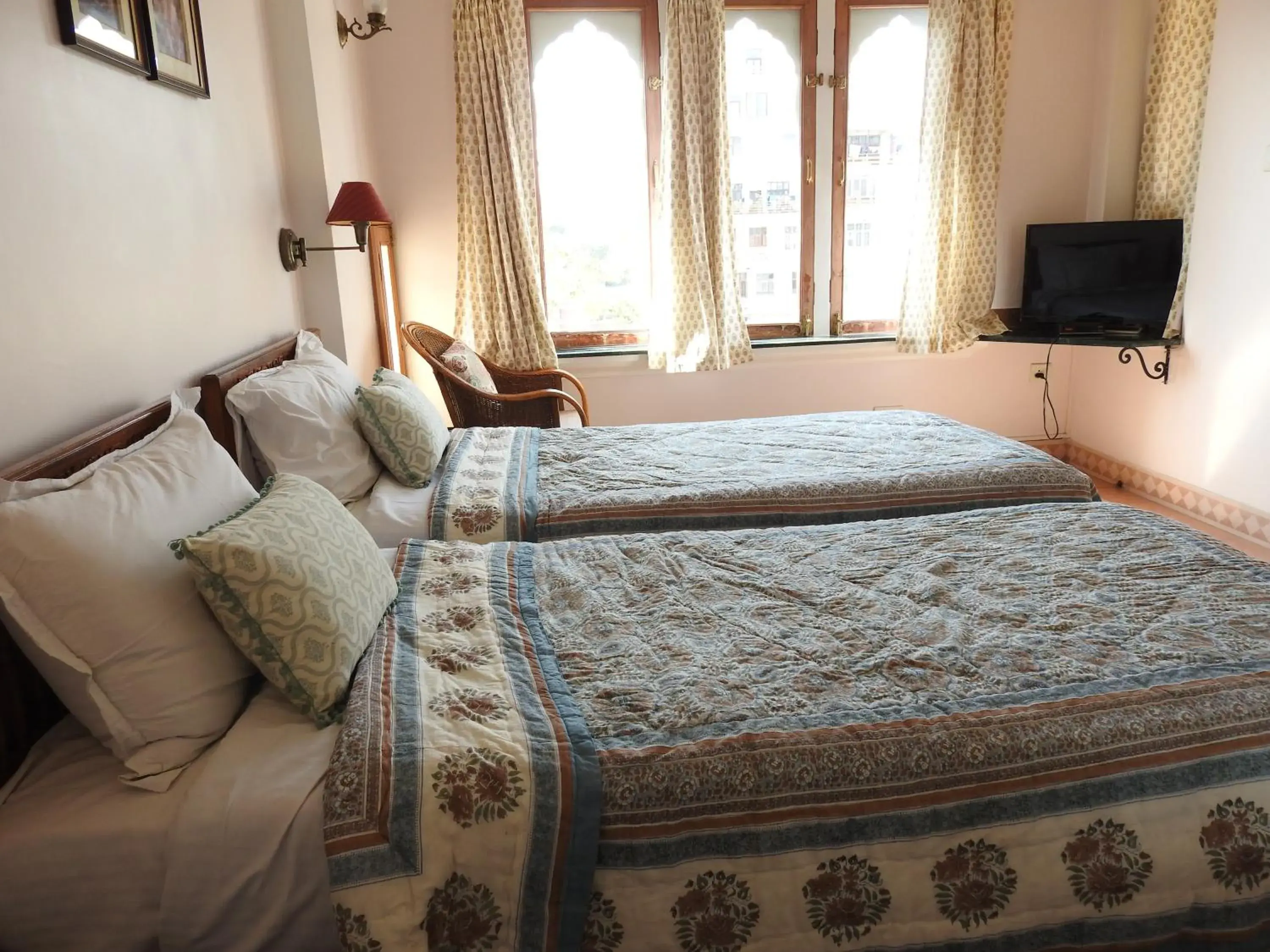 Bed in Om Niwas Suite Hotel