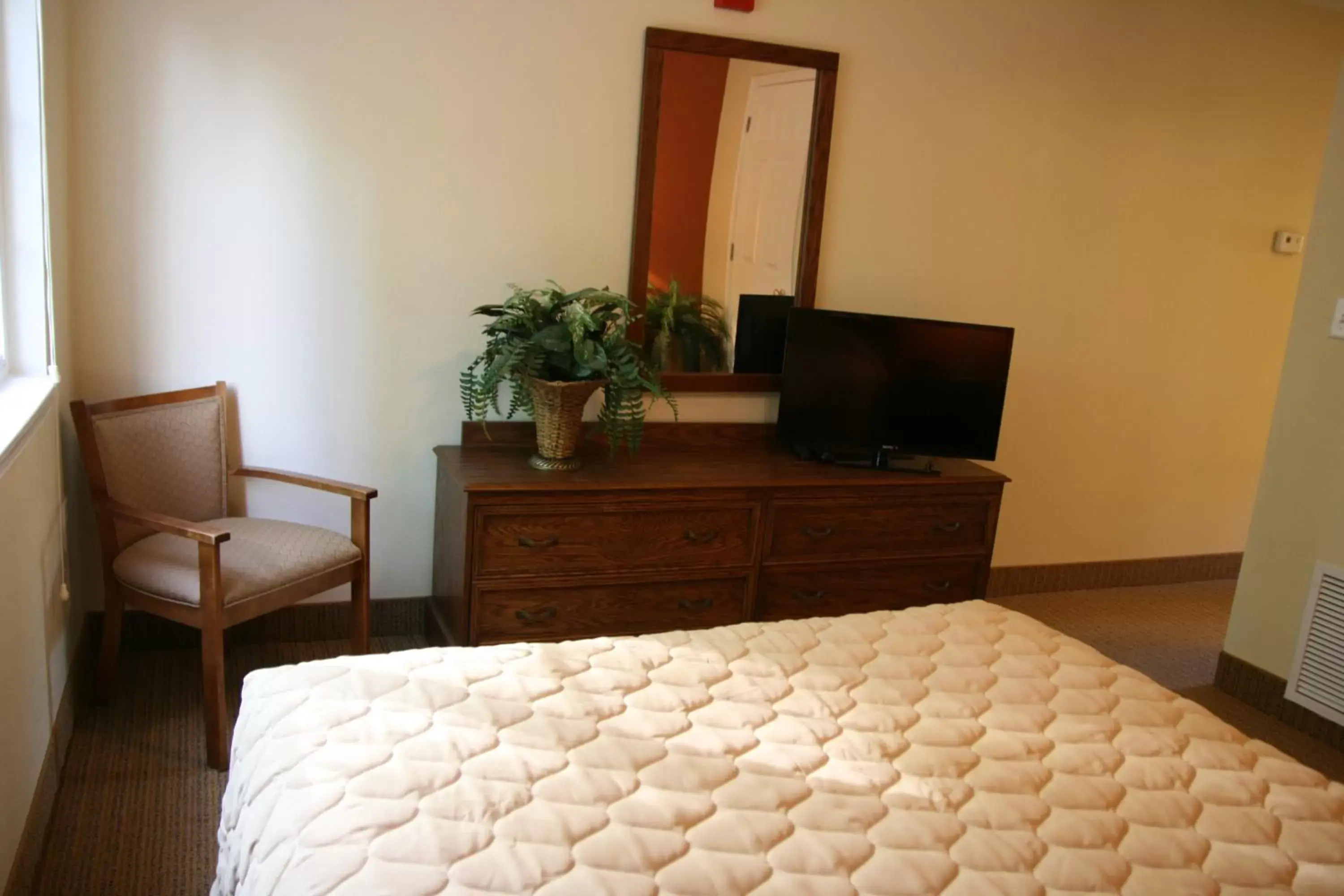 Bed, TV/Entertainment Center in Affordable Suites of America Fredericksburg