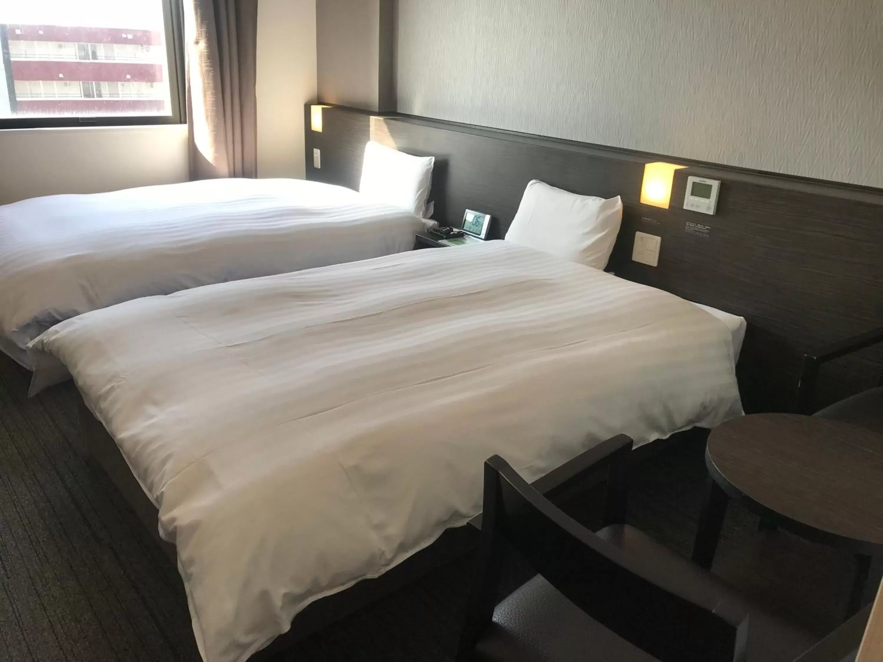 Bed in Dormy Inn Higashi Muroran