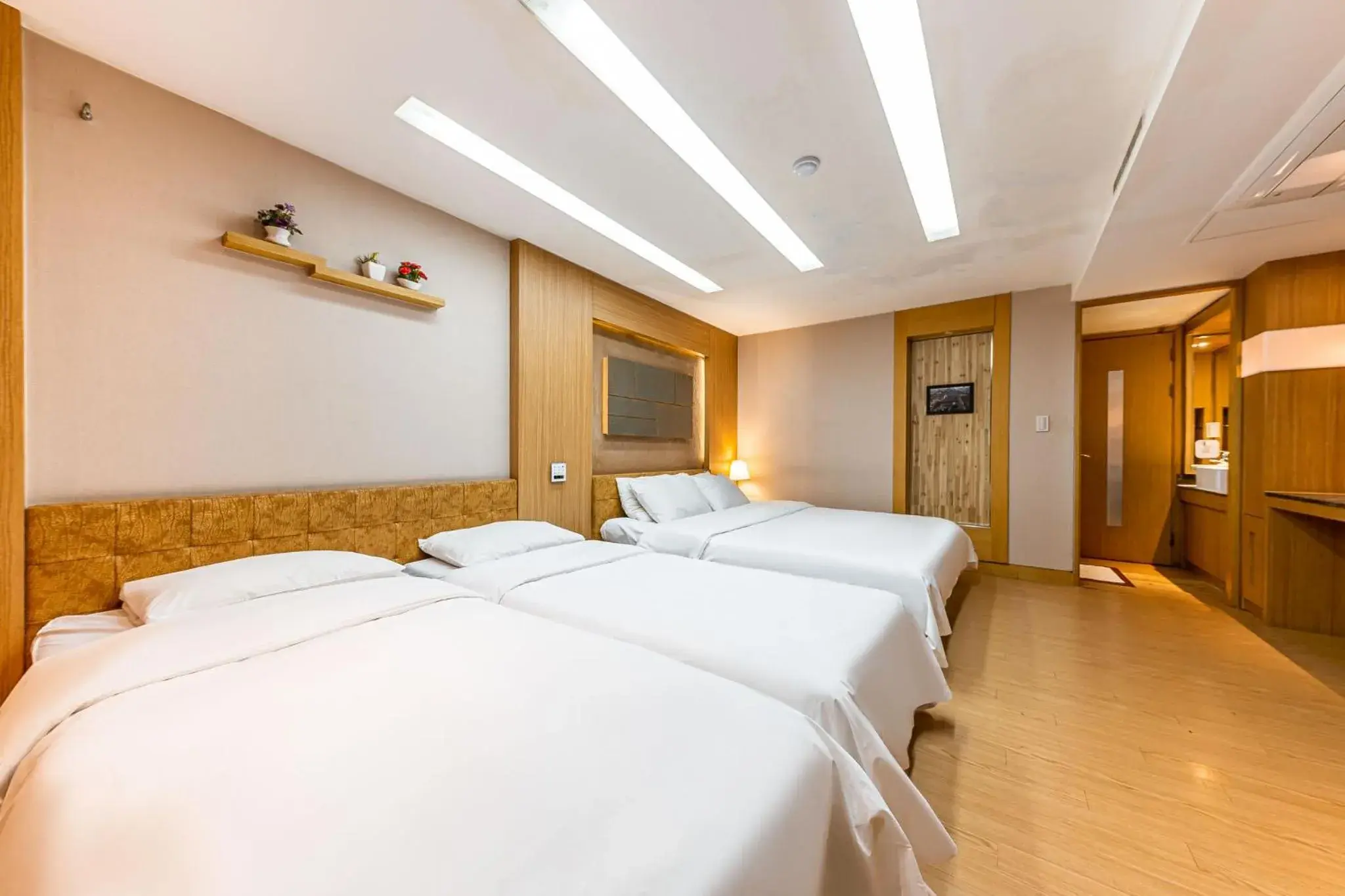 Bed in Friendly DH Naissance Hotel by Mindrum Group Bed in Friendly DH Naissance Hotel by Mindrum Group