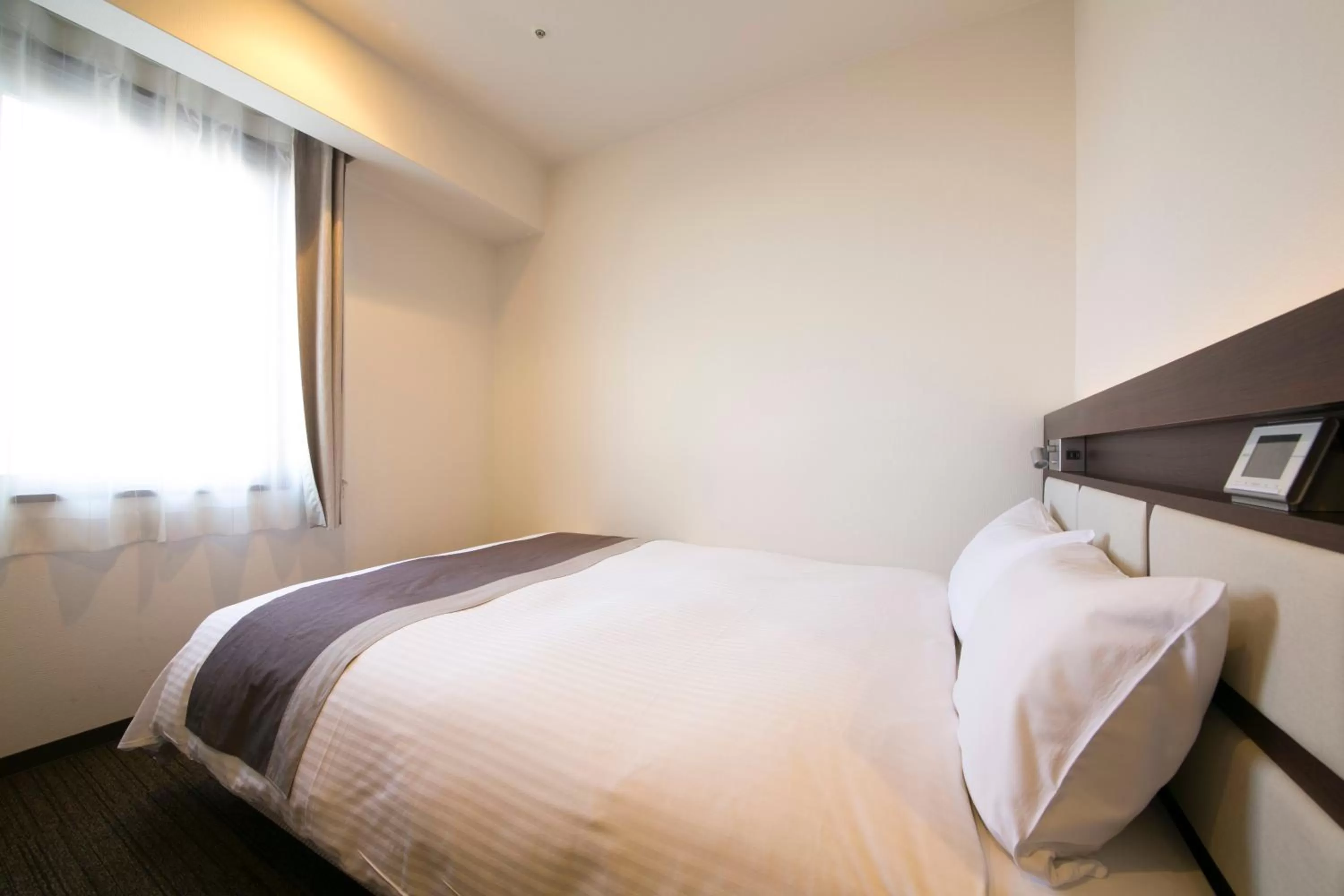 Bed in Urban Hotel Minami Kusatsu