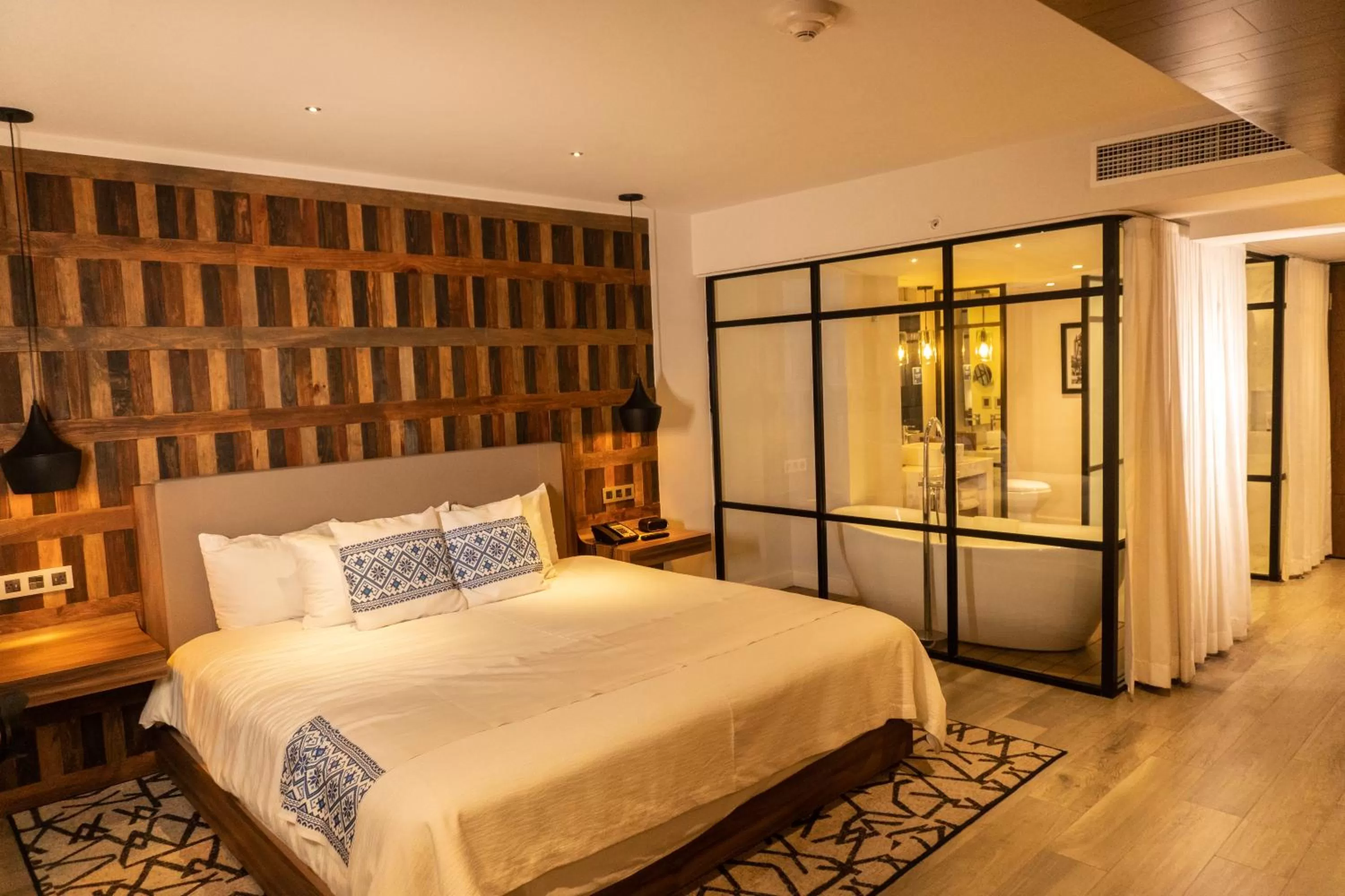 Bed in Hotel Indigo Guadalajara Expo by IHG