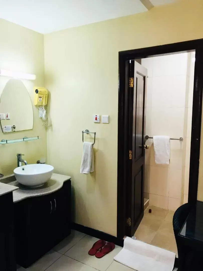 Bathroom in Urban Rose Hotel & Apartments