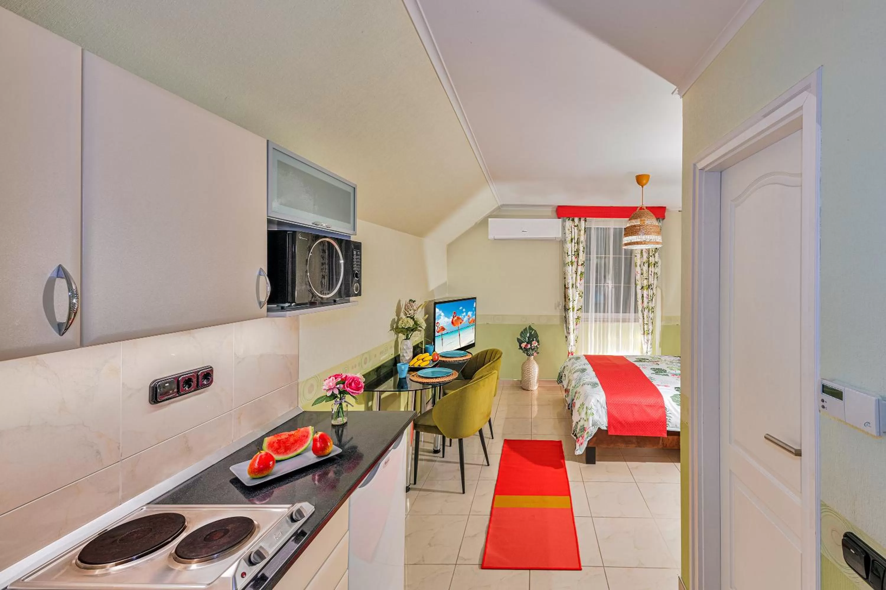 Kitchen or kitchenette, Bed in Vintiamo Apartmanok