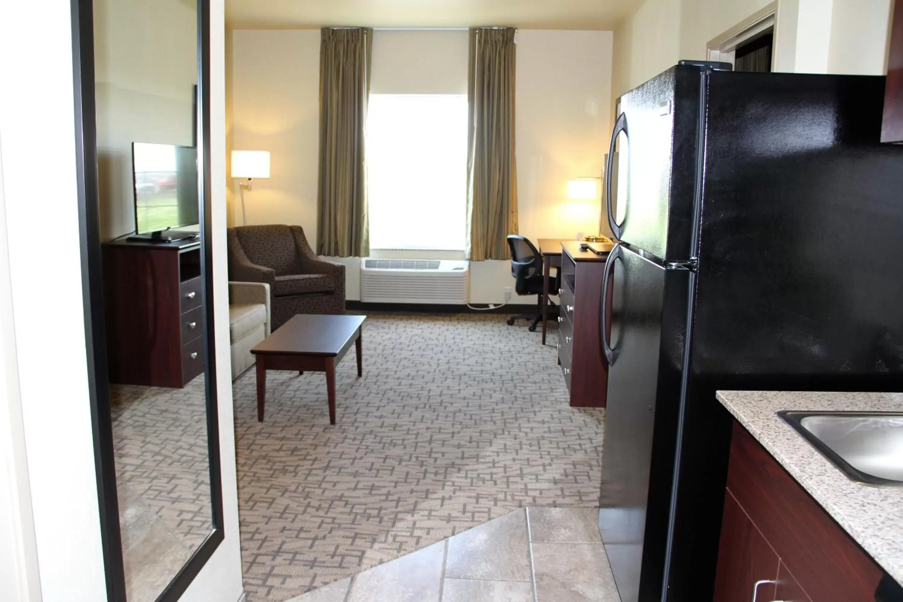Living room, Room Photo in Cobblestone Hotel & Suites - Devils Lake