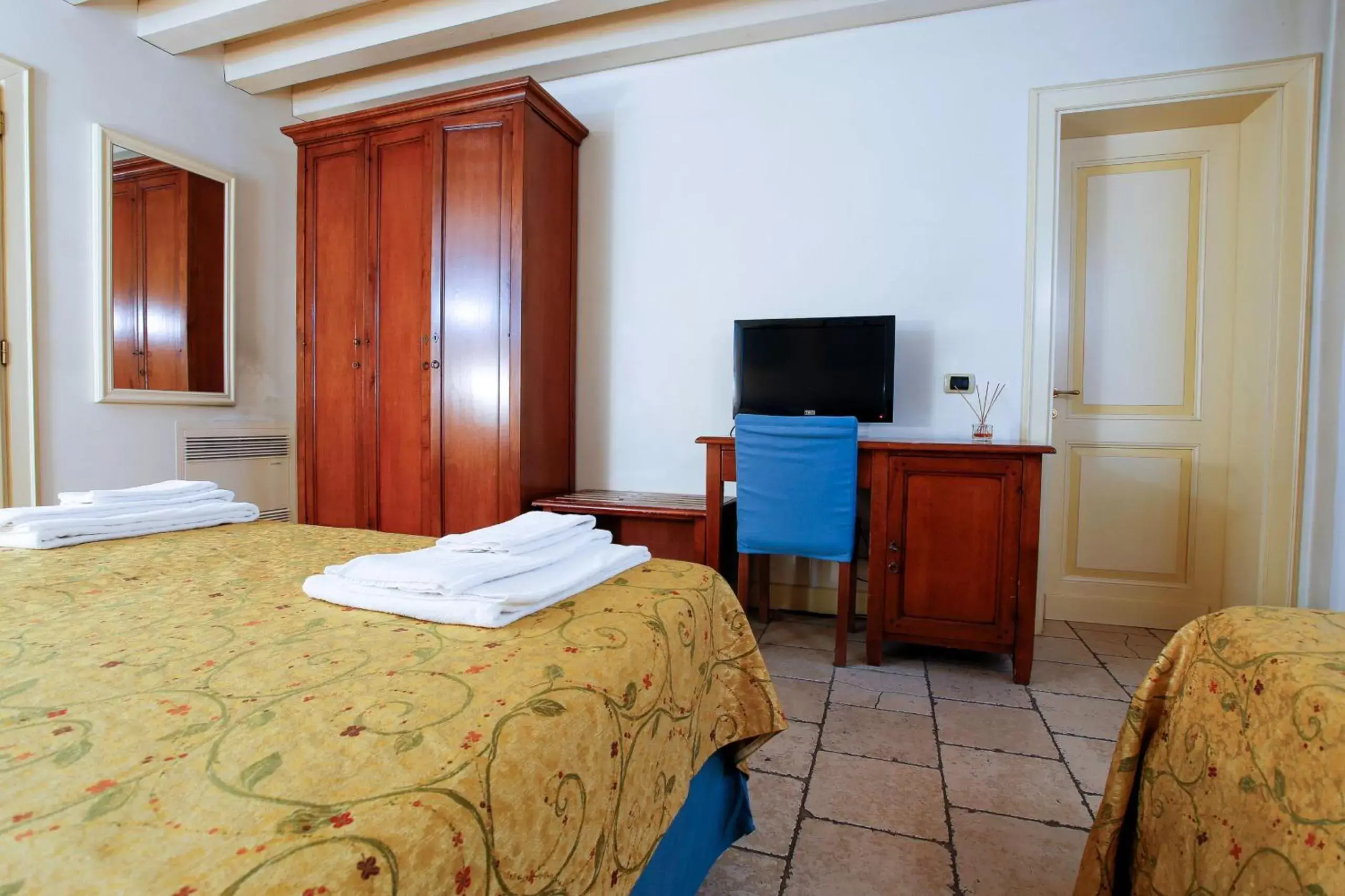 Bed, TV/Entertainment Center in Relais Villa Selvatico