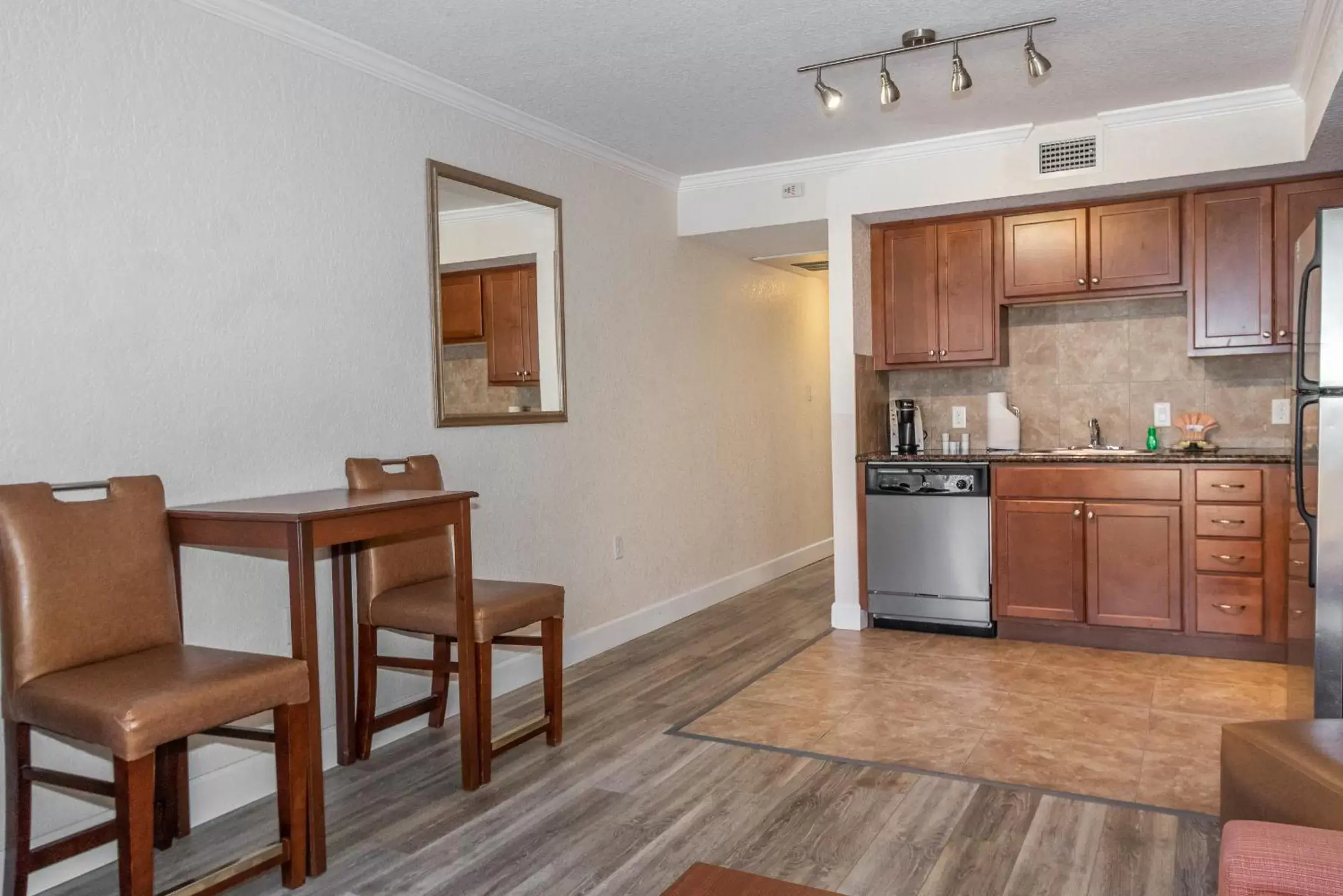 Living room, Kitchen/Kitchenette in Coconut Cove All Suite Hotel